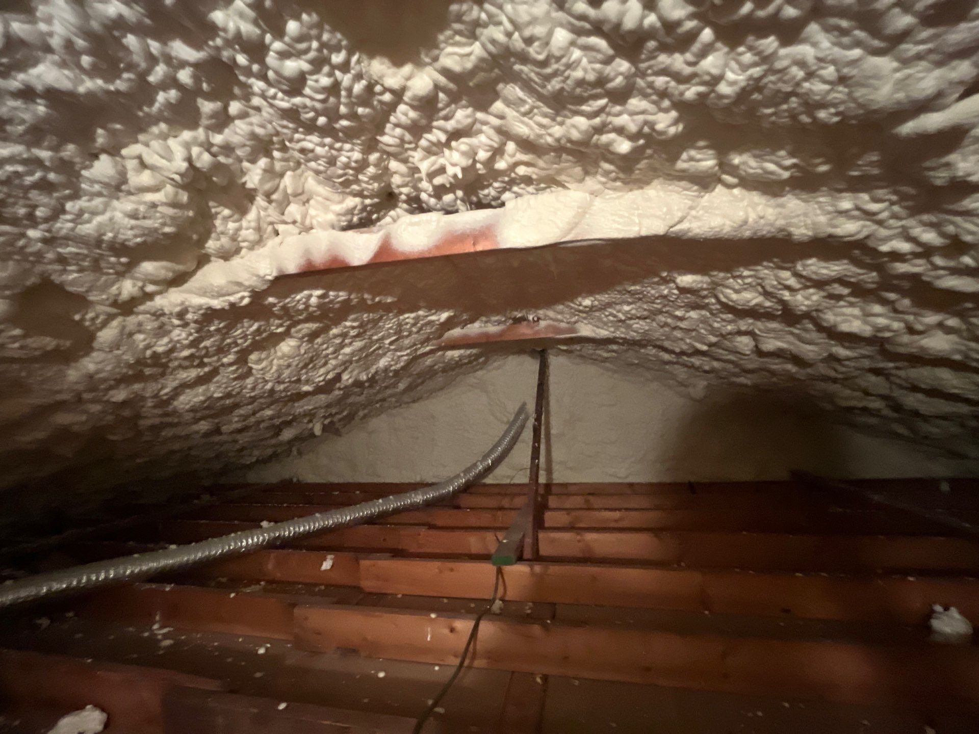 Garage ceiling using open cell spray foam by NYS Foam & Energy