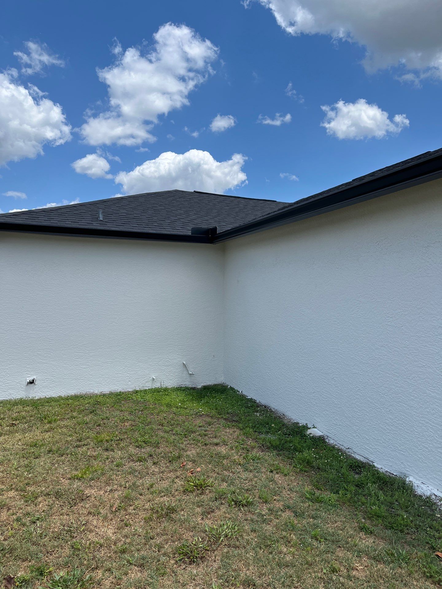 Black Seamless Gutters and Downspouts in Fort Myers FL by Gutter Professors