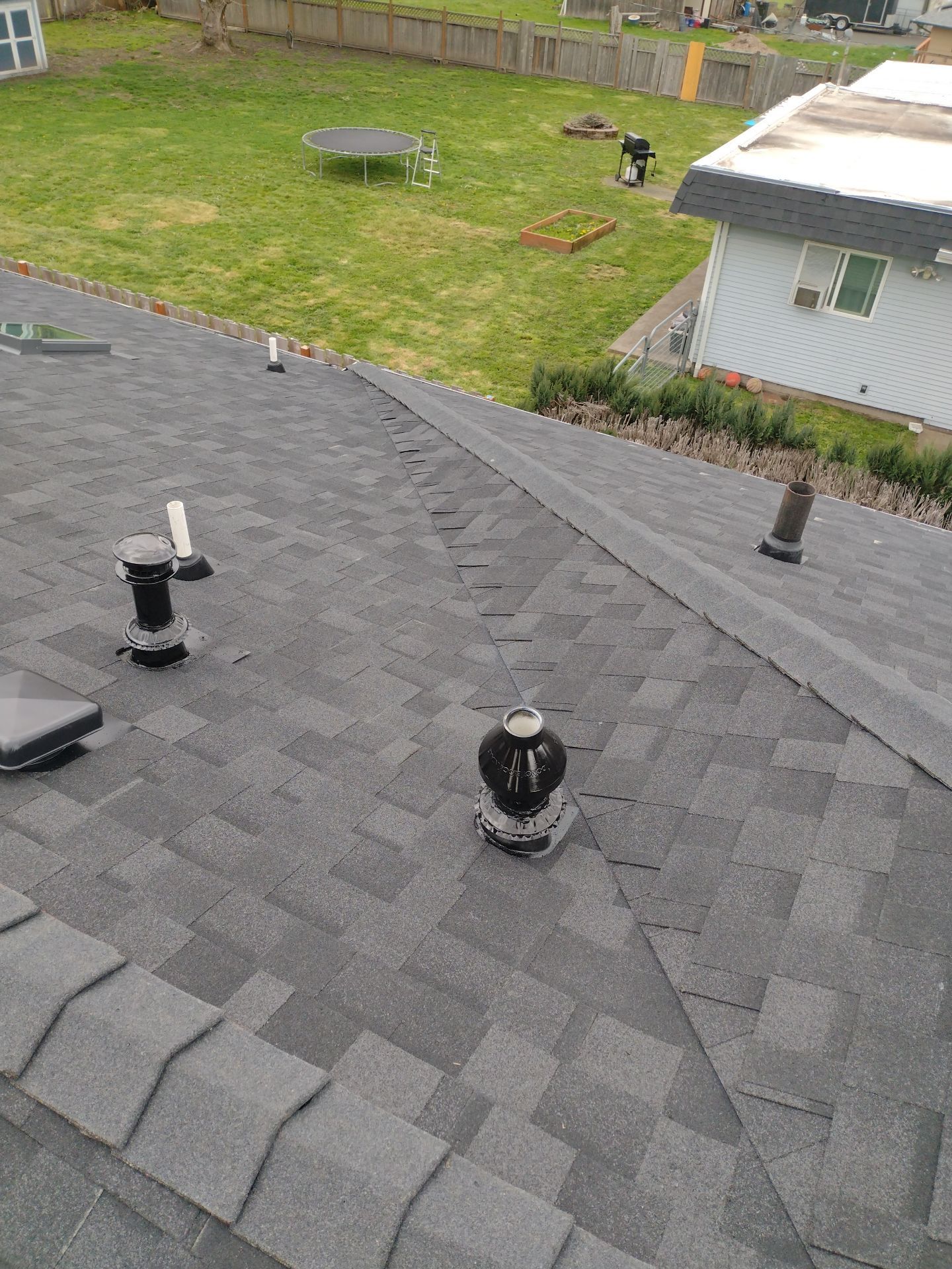 Residential Roofing Installation using IKO Dynasty (Color: Granite Black) by Orezona Building & Roofing Company, Inc.