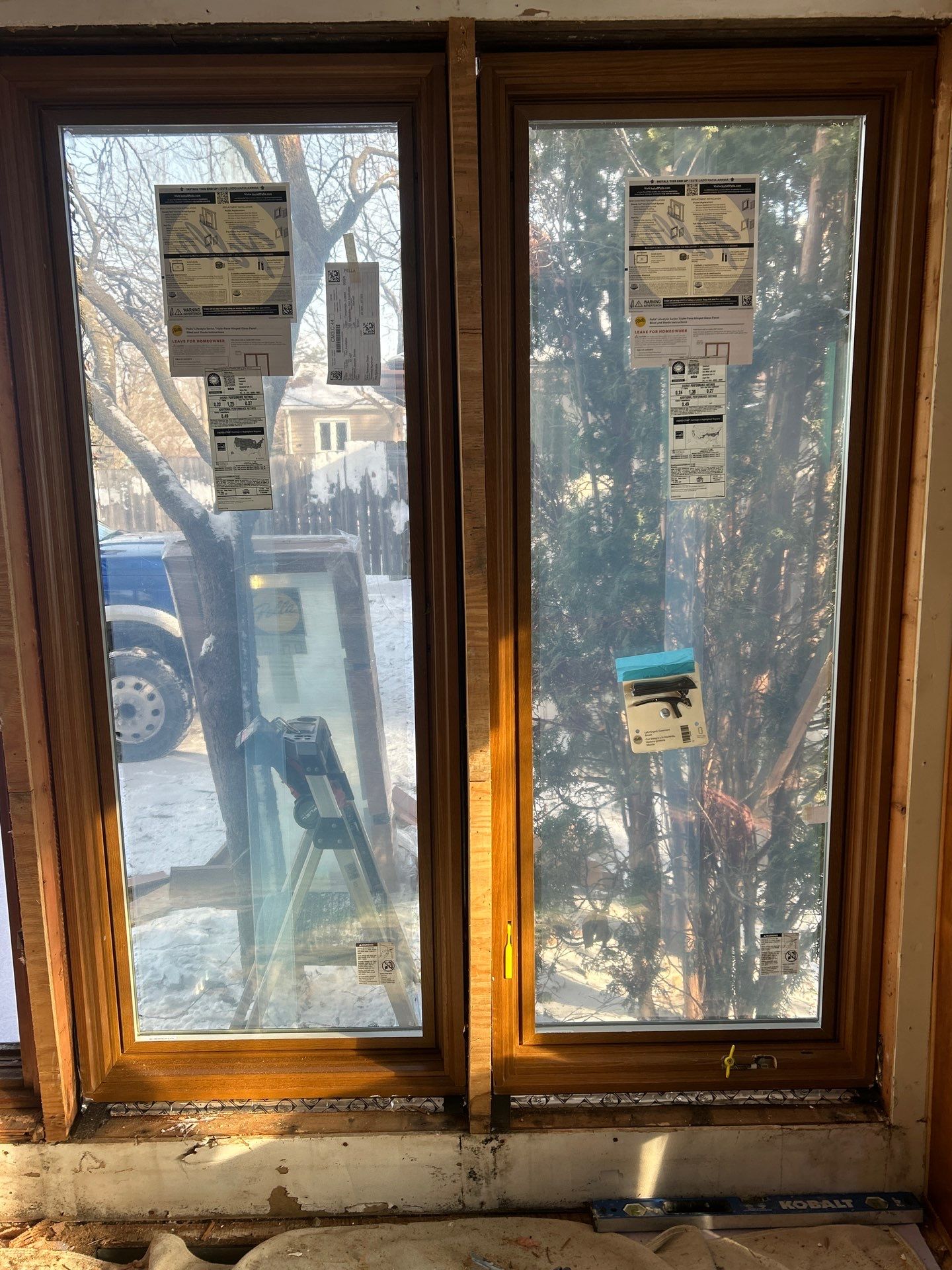 Black-Frame Pella Lifestyle Upgrade on a Partial Brick Home by United Windows and Siding LLC