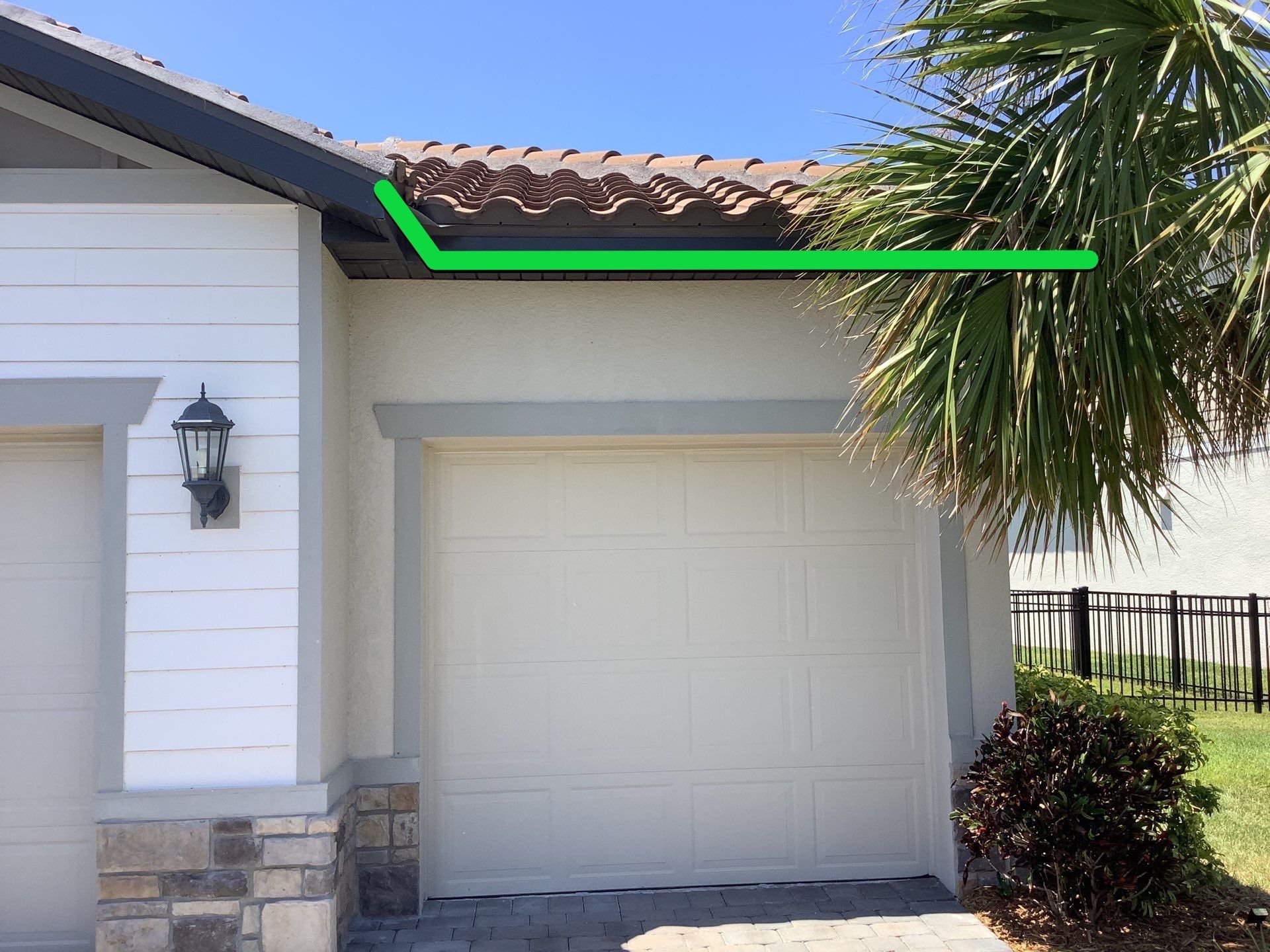 Musket brown seamless gutters with splash guards, new downspouts, and extensions in Bradenton, FL by Gutter Professors