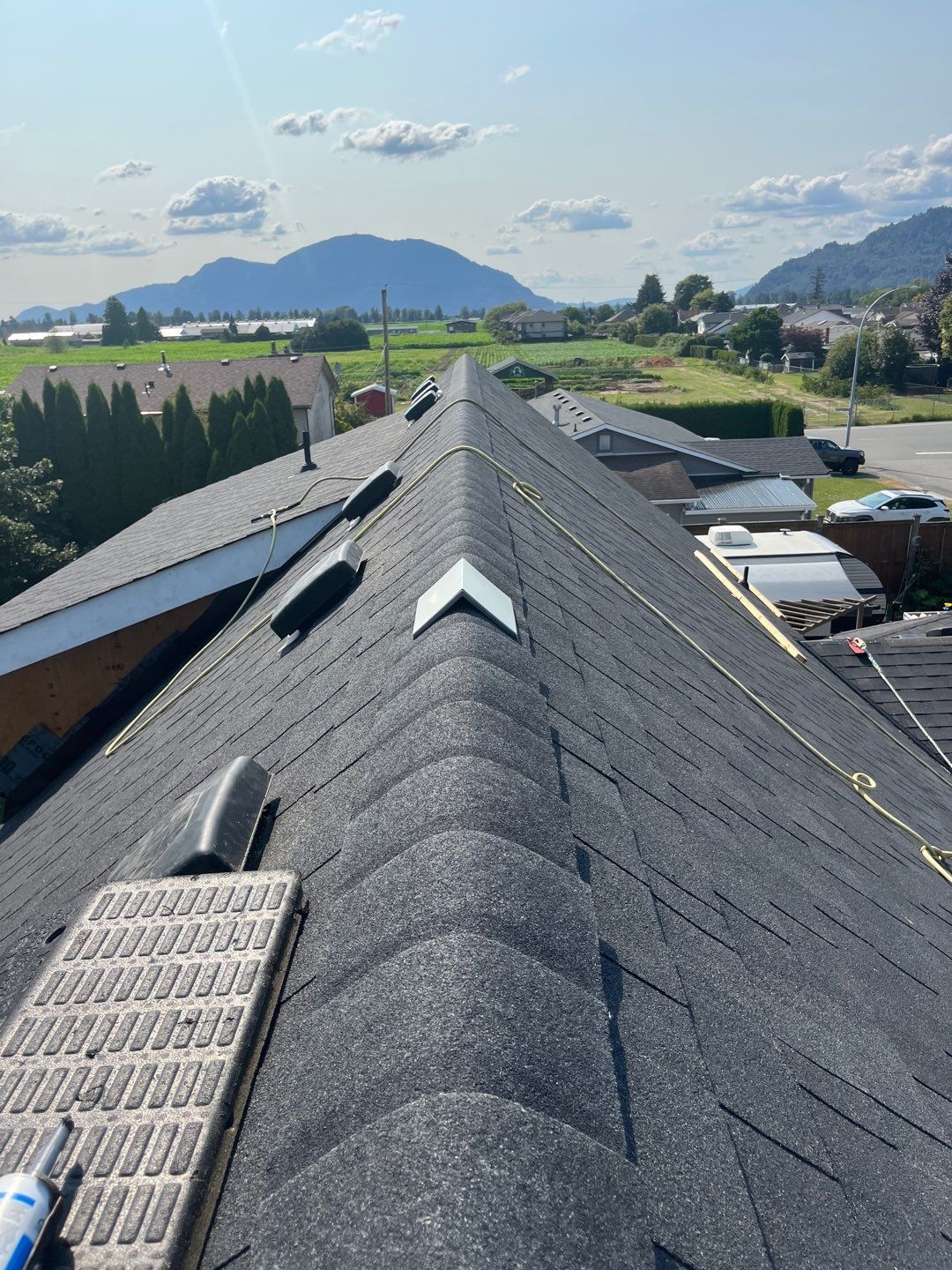 Residential Roofing Installation using OC onyxs black shingle by Top Notch Roofing Inc