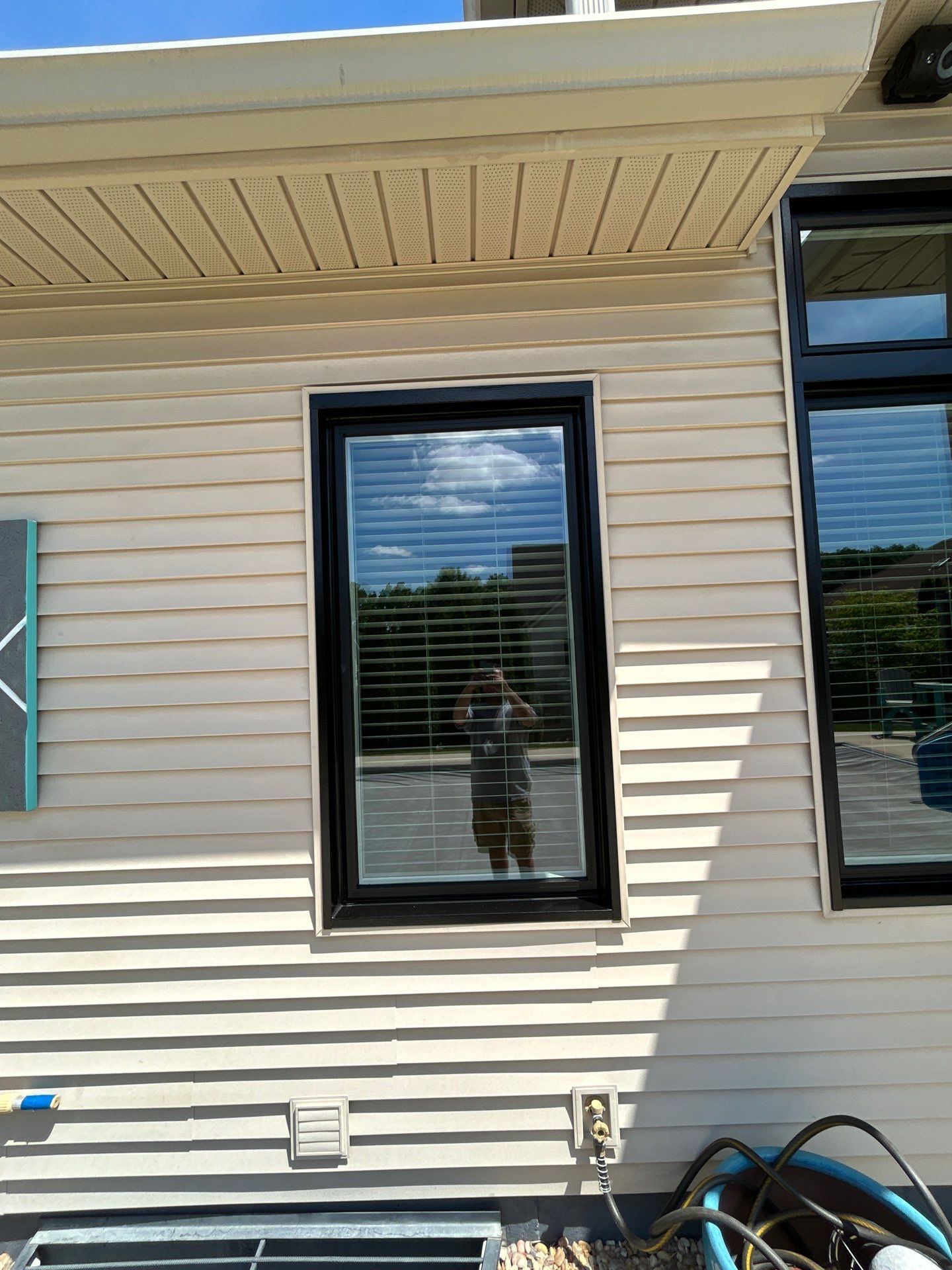 Black Vinyl Window Installation by Merrifield Exteriors, LLC