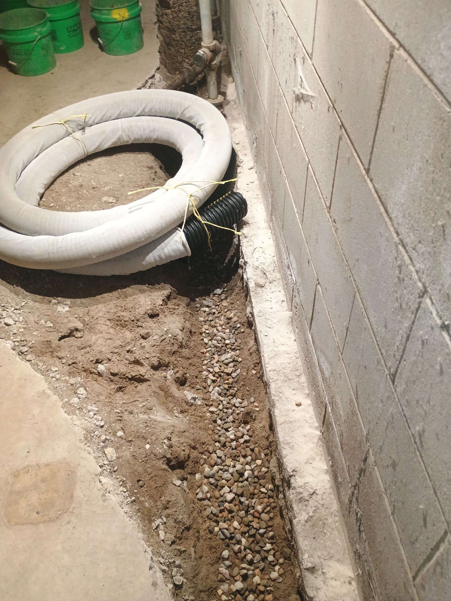 Interior Drain Tile & Buried Discharge in South Minneapolis by Waterproofing Northeast