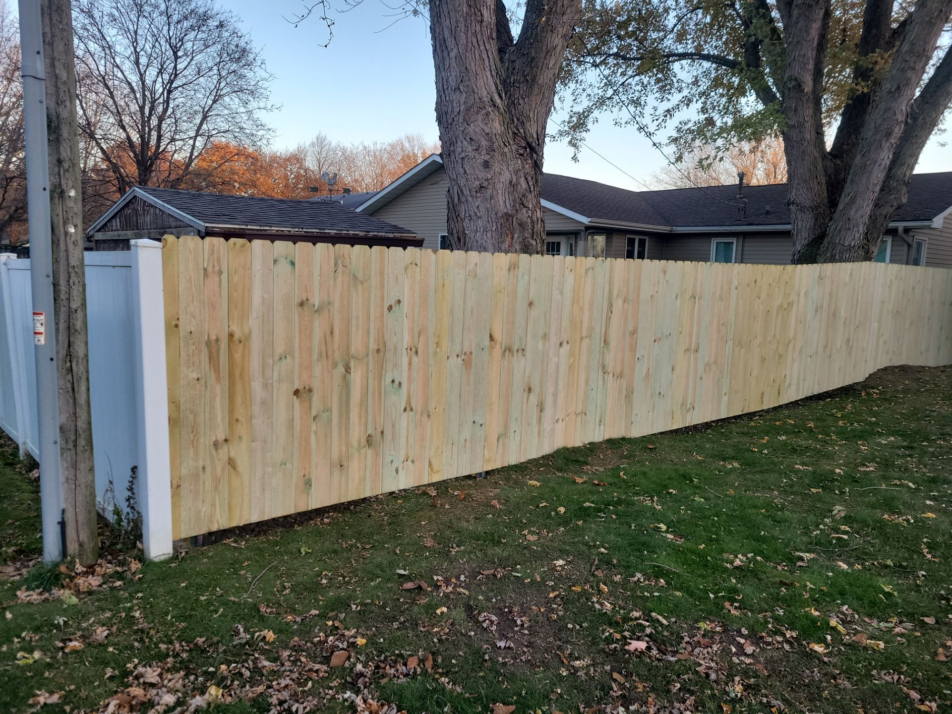 New Pressure-Treated Wood Privacy Fence and Gate in Charles City by Perfect Picket Fence and Stain