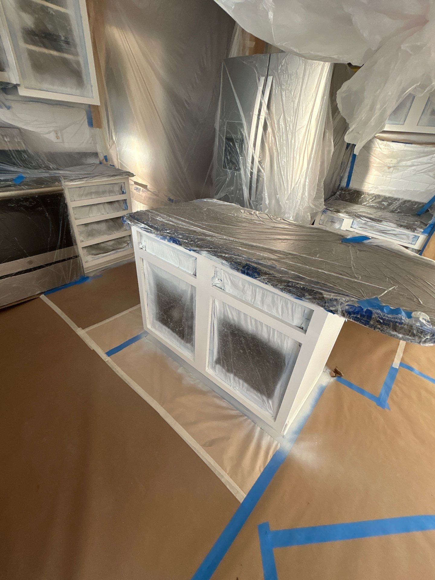 Cabinet painting by GonzalezPainters & Contractors Inc 