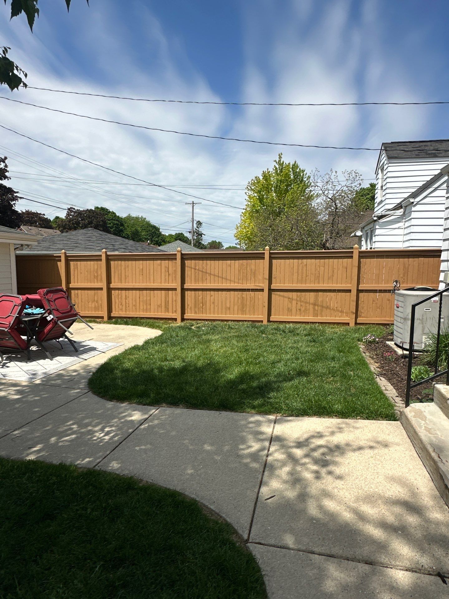 Milwaukee Wood Privacy Fence Installation and Concrete Patio Upgrade by OCS Contracting Services