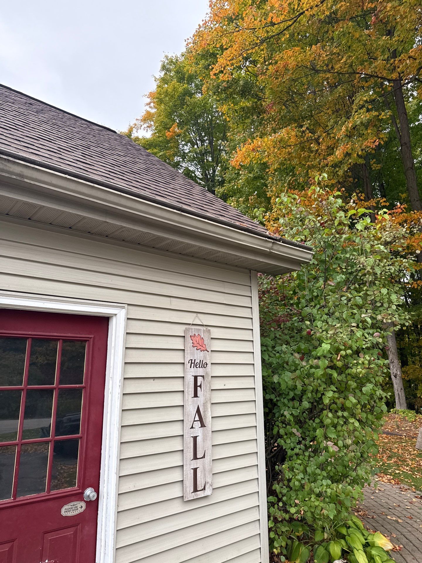 Traverse City Gutter Helmet Installation on a Shingled Roof Home by Rainbow Seamless Systems
