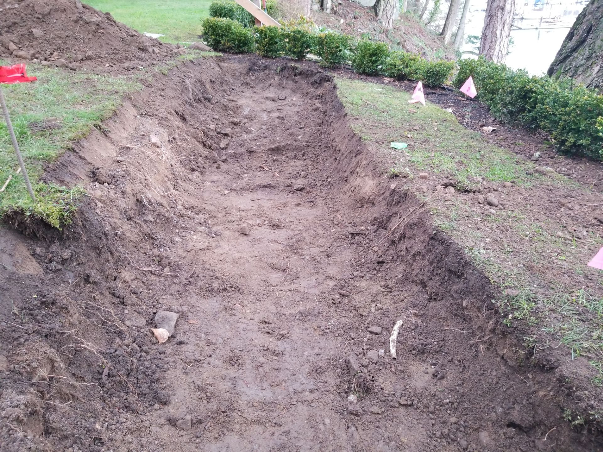 Coastal Landscape Restoration & Retaining Structure - In progress by Habanero Garden and Exterior Care