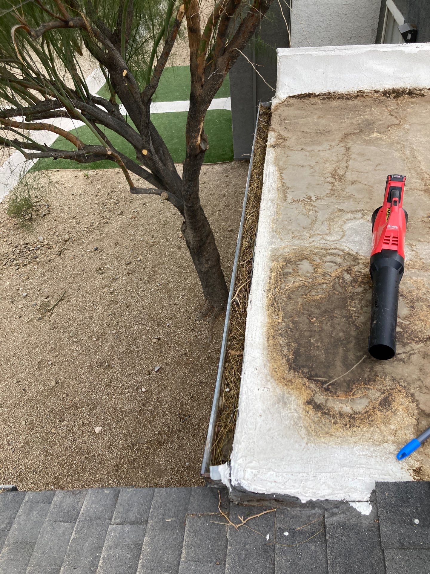 Commercial gutter cleaning Las Vegas before photo with filled gutters