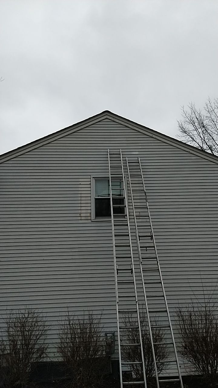 James Hardie Siding  using James Hardie Board and Batten, White by Absolute Roofing and Construction