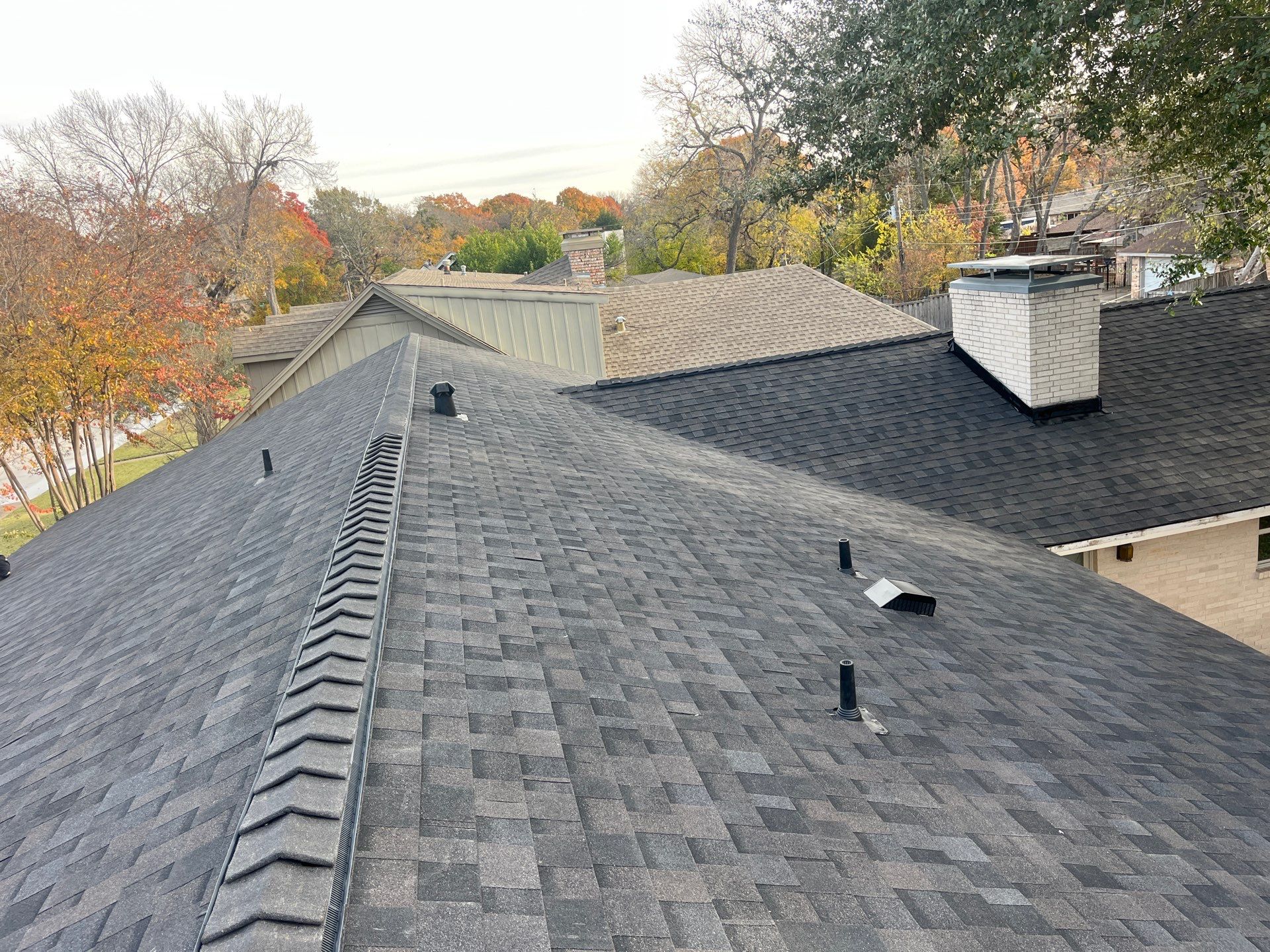 IKO Brownstone- White Brick  by Tejas Roofworks + Restoration