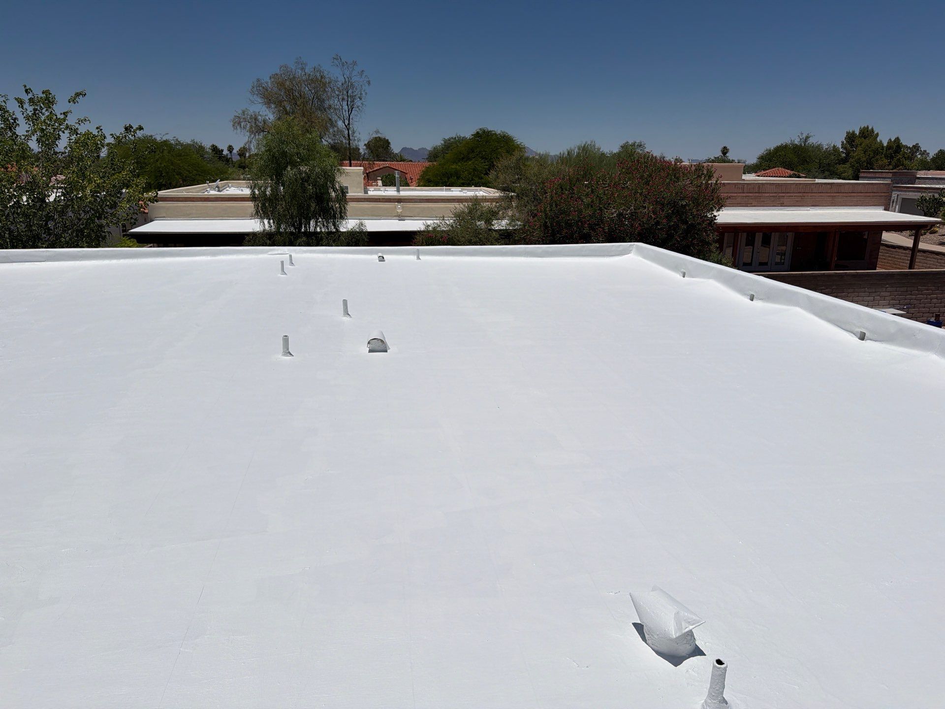 Tucson Residential Roof Restoration with Tile and Elastomeric Coating by West Coast Roofing AZ