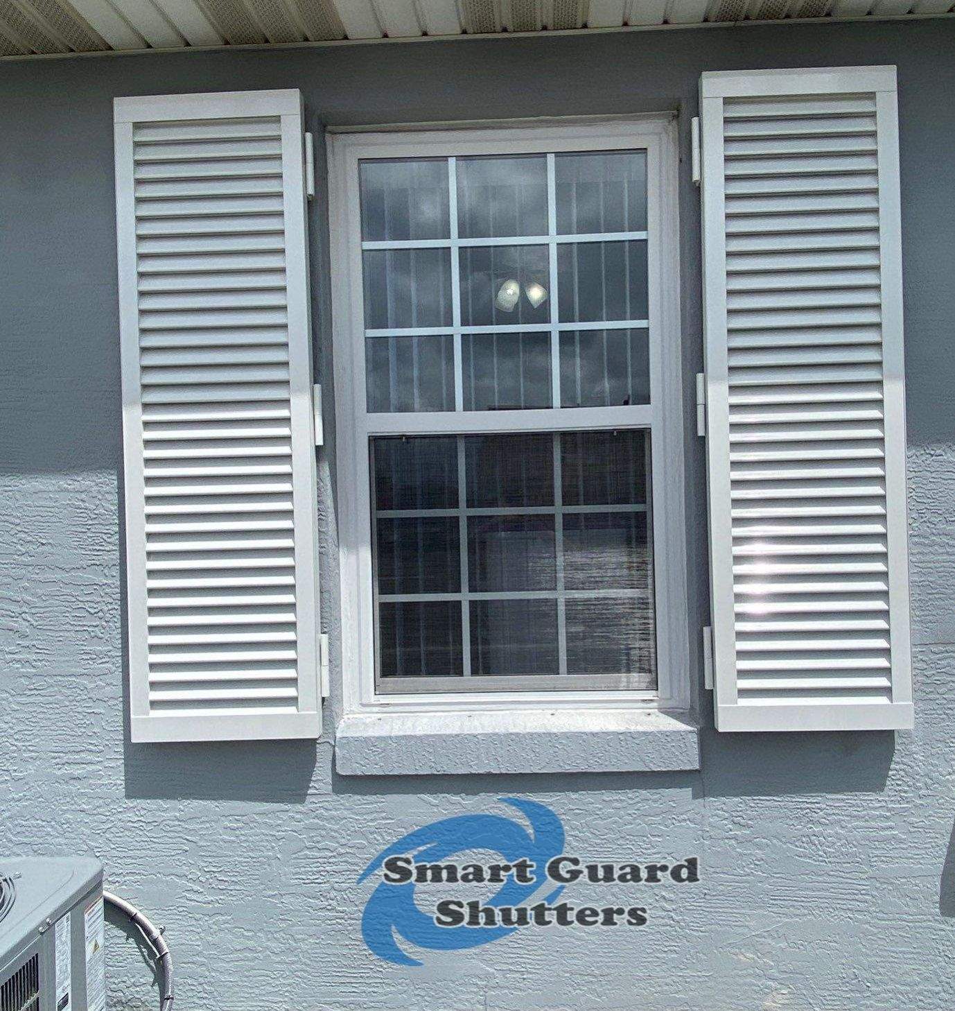 Impact Colonial Shutters in Signal White by Smart Guard Shutters
