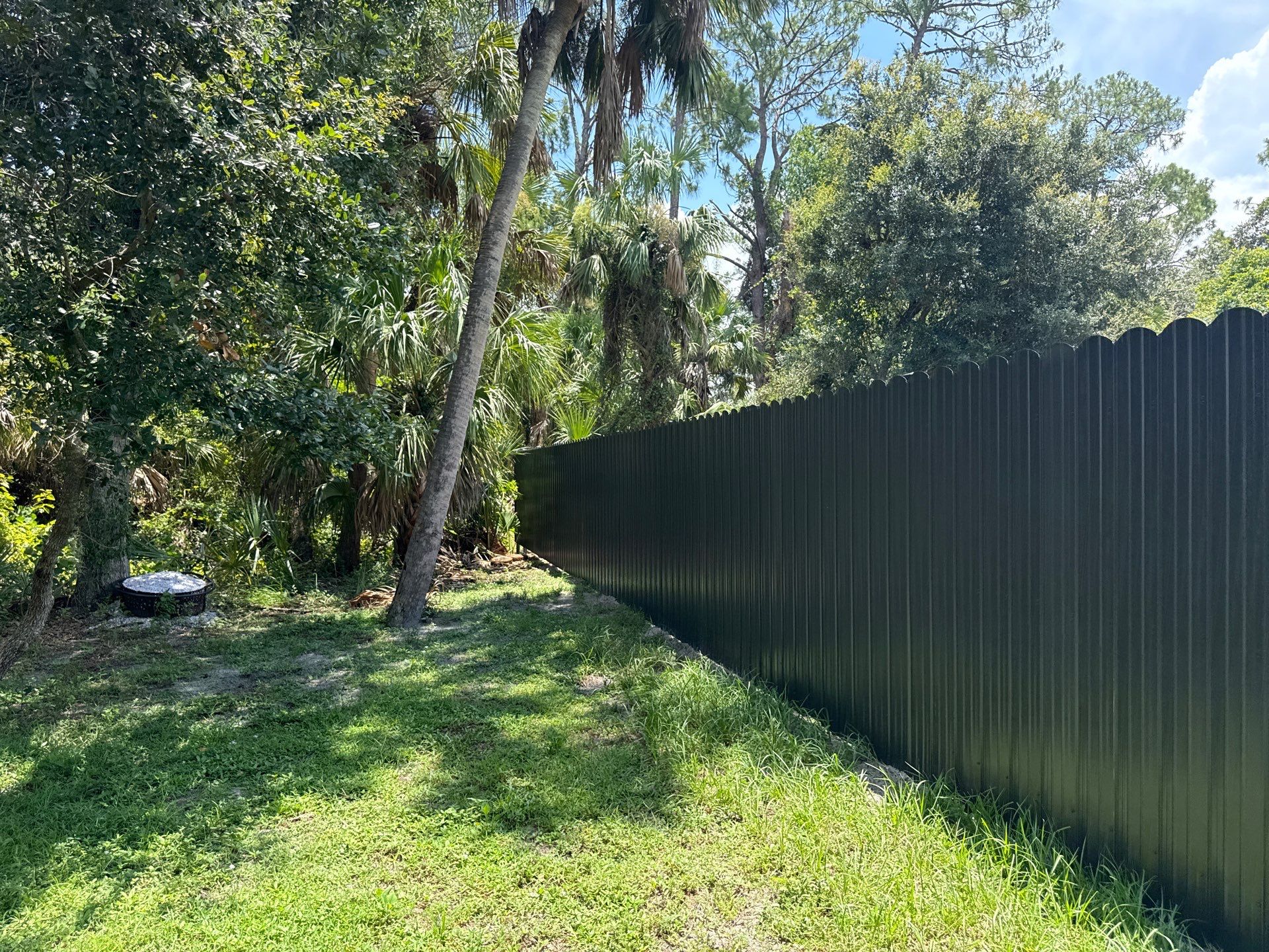 Bronze Scalloped Metal Privacy Fence Installation in North Port by True Fence LLC