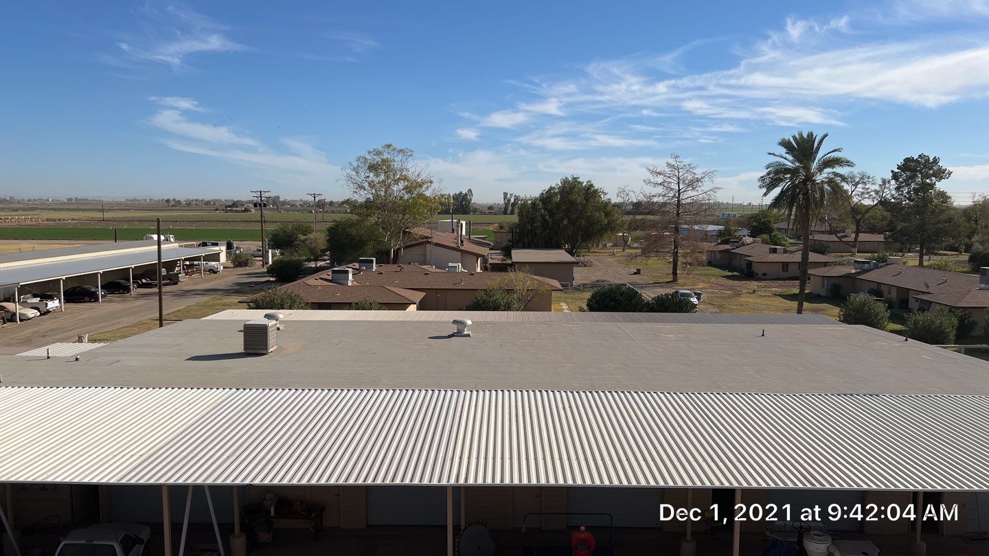 Metal roof restoration on commercial roof using Conklin Benchmark/PUMA XL fabric and coating by Straight Edge Roofing Inc