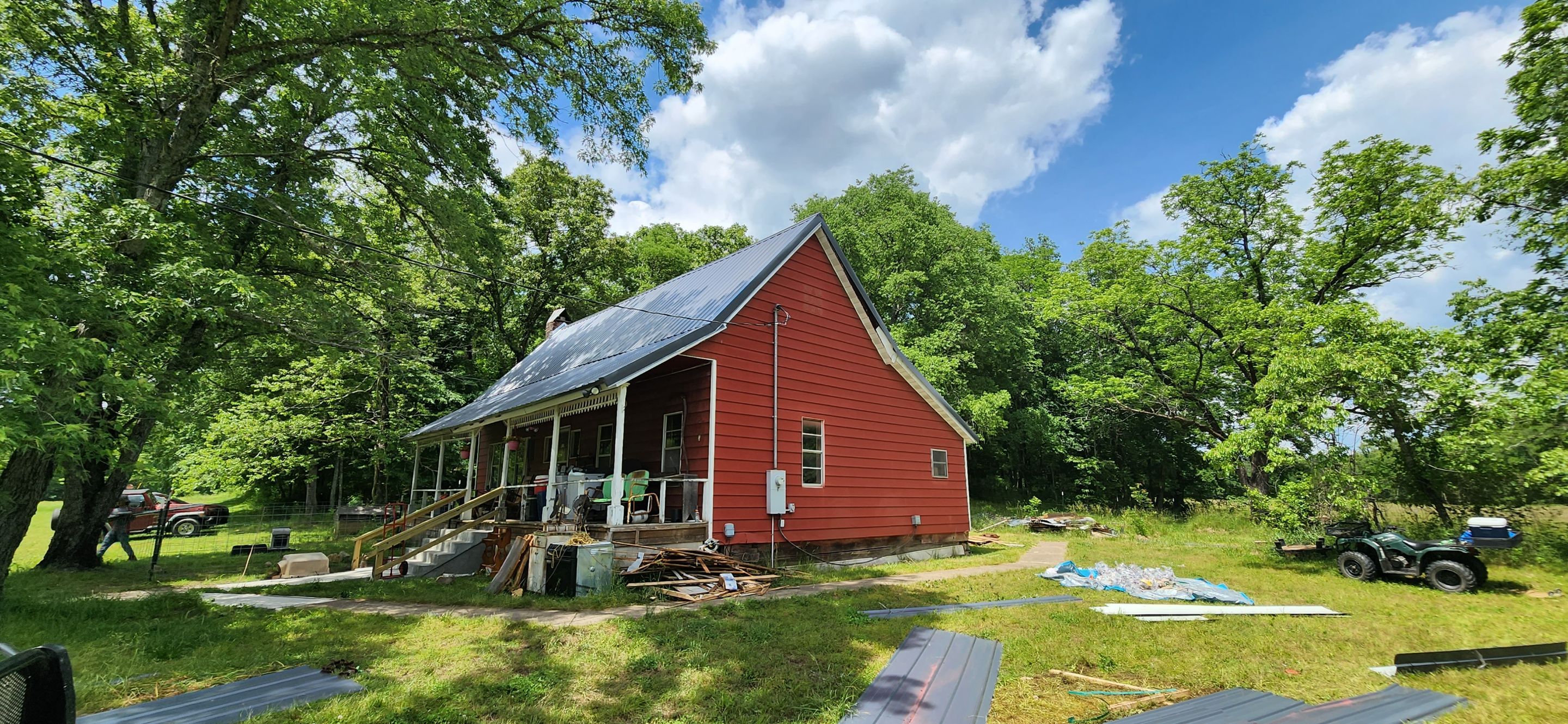 Residential Roofing Installation using 26 Gauge Colored Panels by Hostetler Roofing