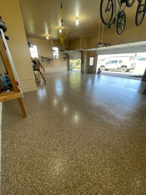 Residential Garage Floor Transformation with Speckled Epoxy Coating