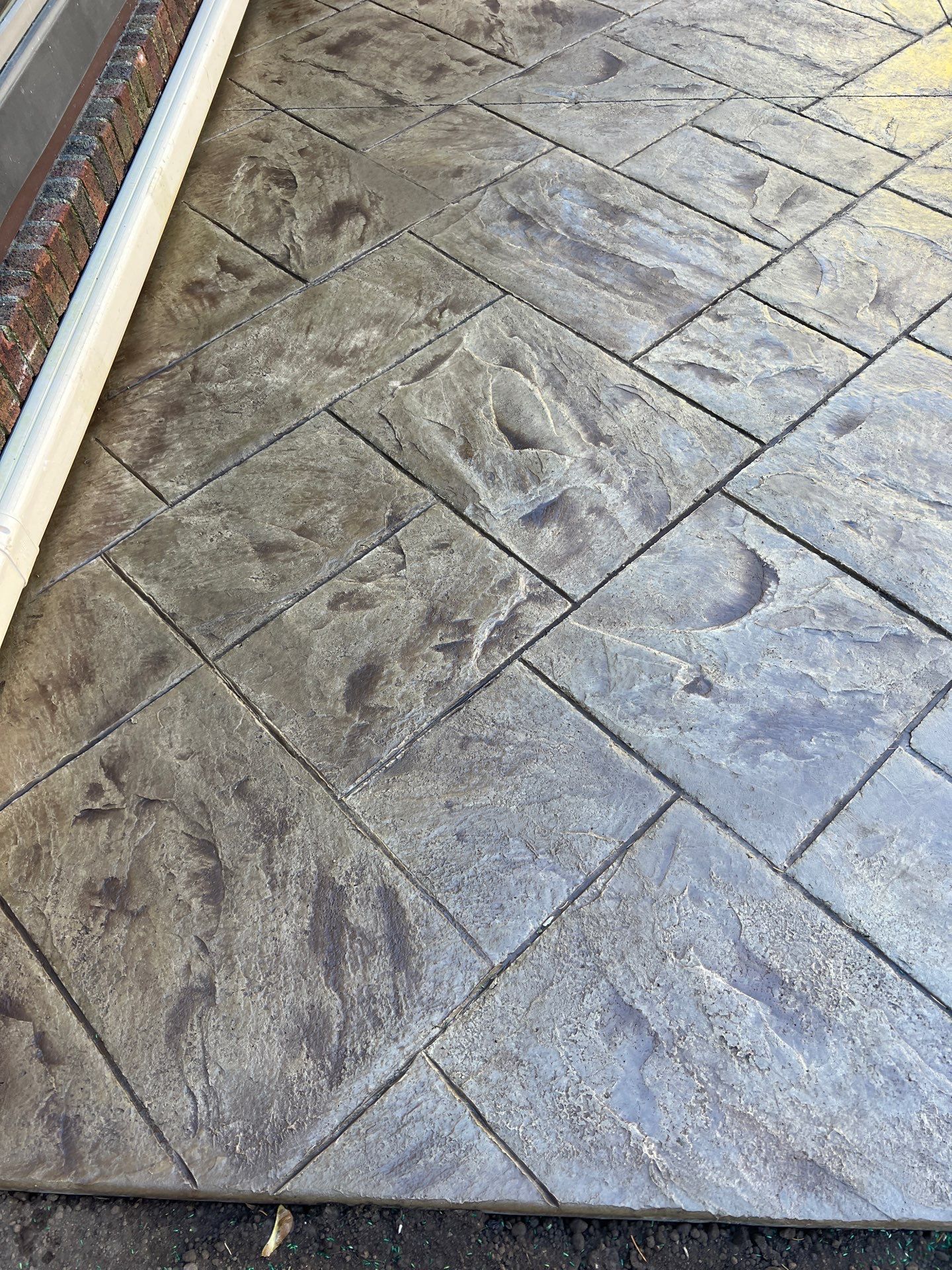 Majestic Ashlar stamped concrete patio  by NG Masonry & Construction LLC