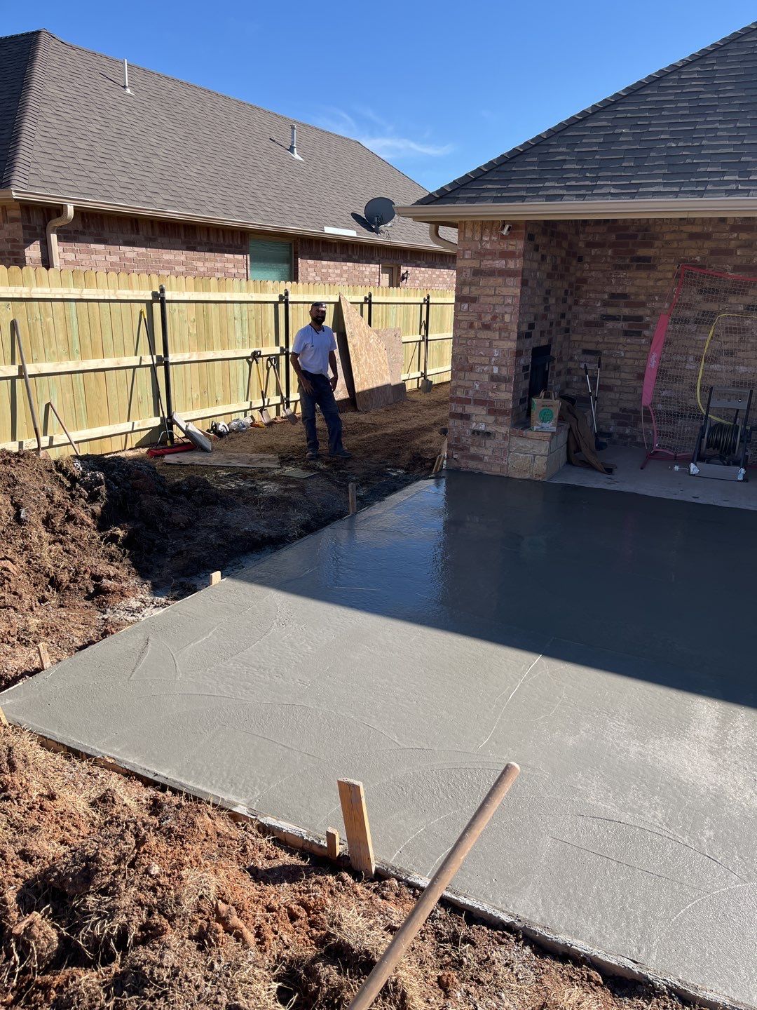 Concrete Slab , Retaining Wall , Fence, and landscape. by Clays Services Inc
