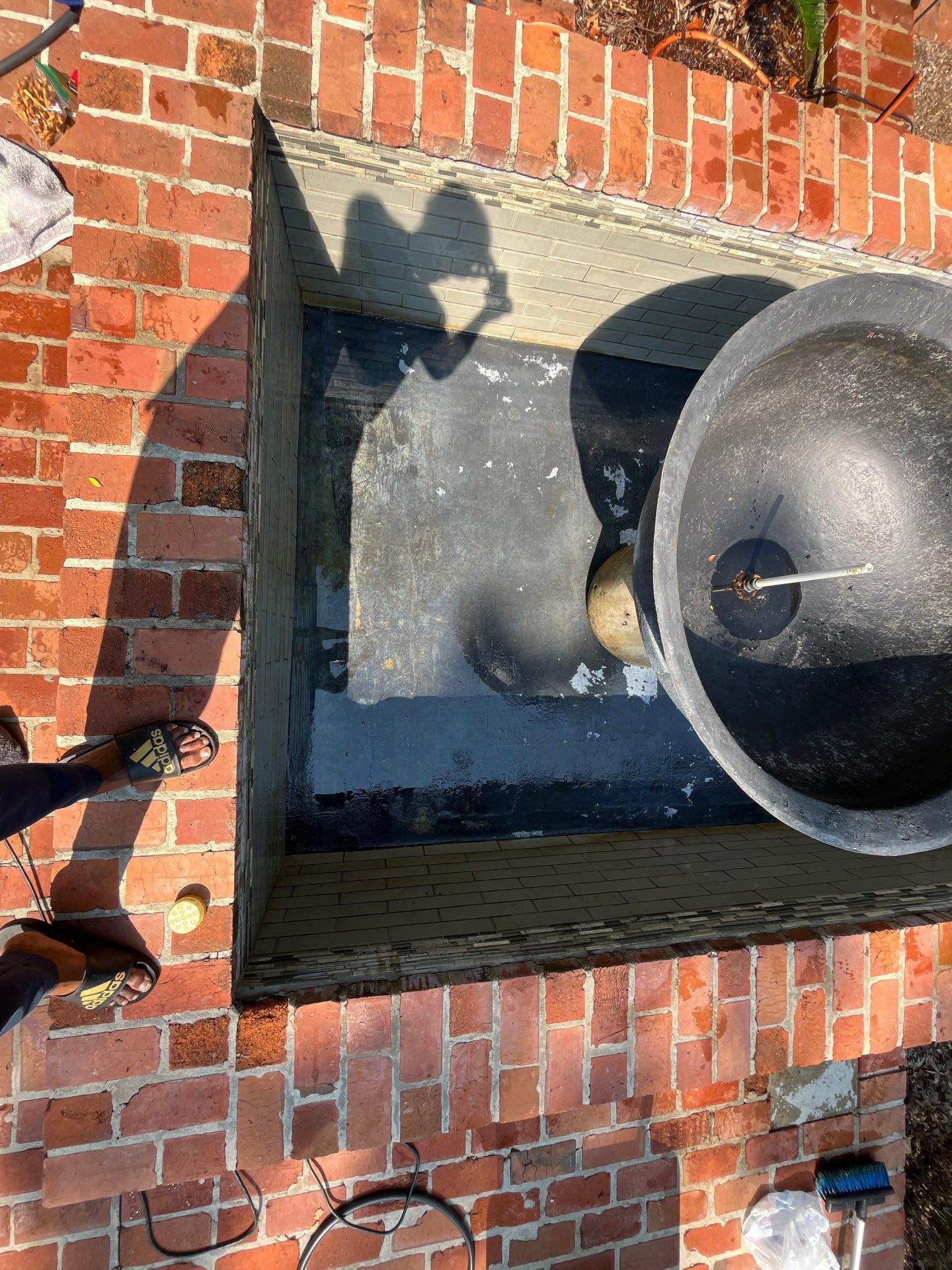 Pool Cleaning using Pool Cleaner by College Bros Outdoor services