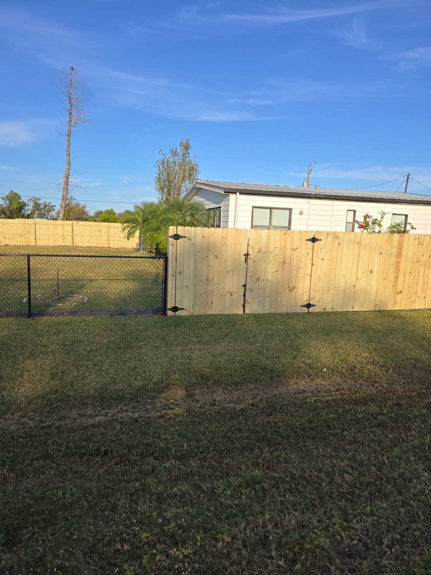 Wood and Chain Link Fence in Port Charlotte by True Fence LLC