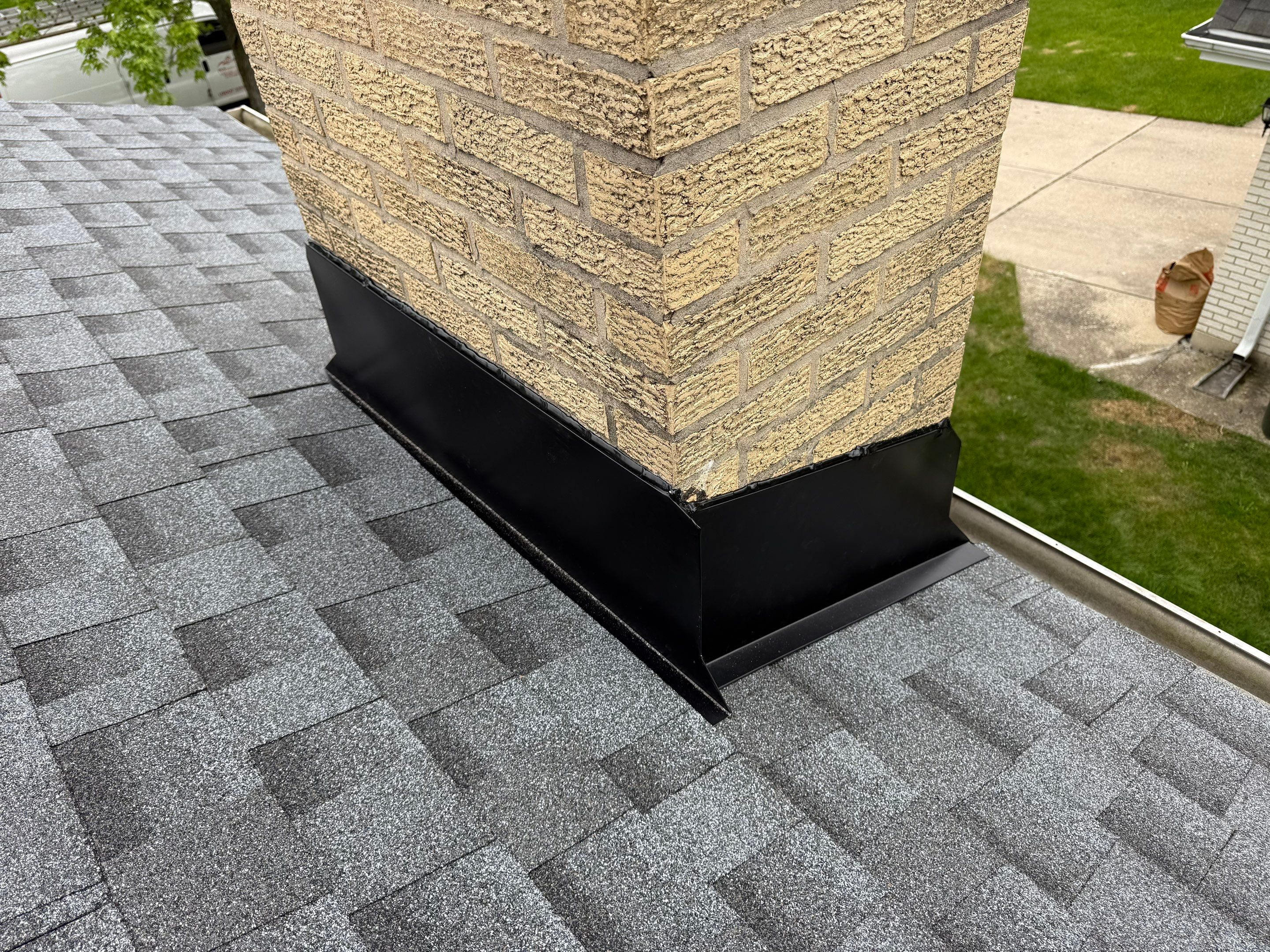 Roof replacement and chimney flashing by Optimal Home Improvement 