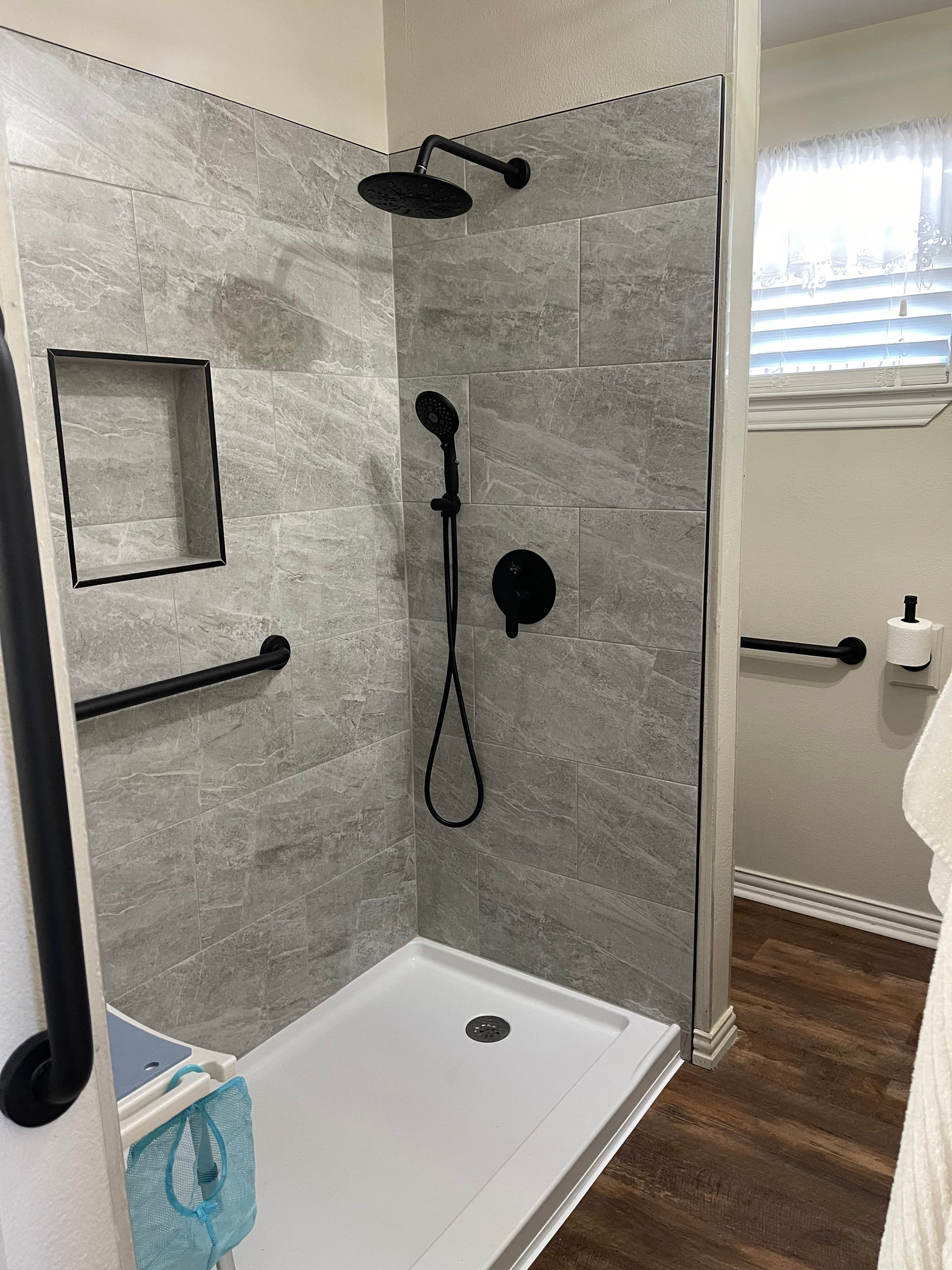 Bathroom Remodel using Tile  by SLM General Contractors & Roofing