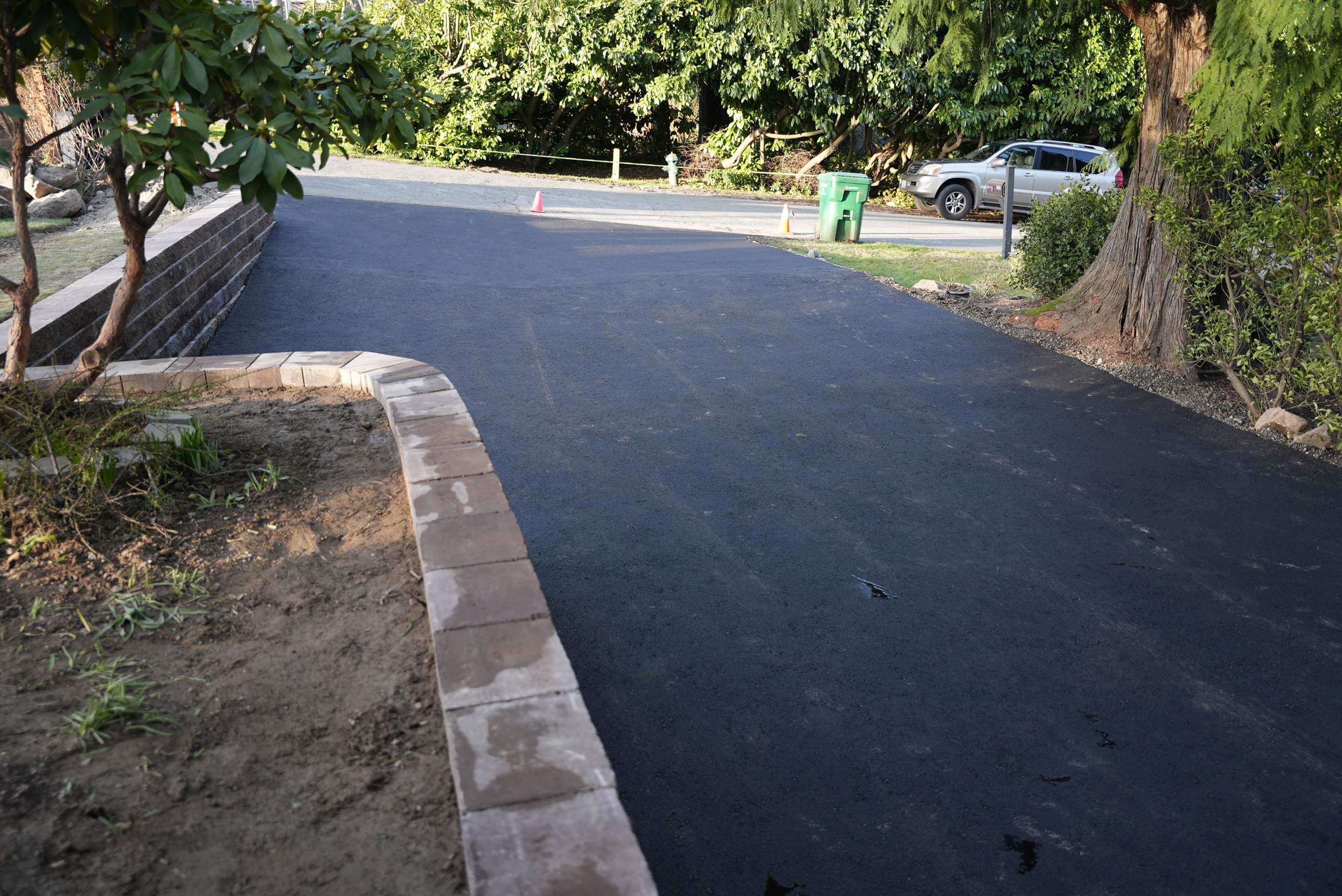Lorra | Asphalt Driveway Repair & Retaining Wall by Jireh Asphalt & Concrete Inc 