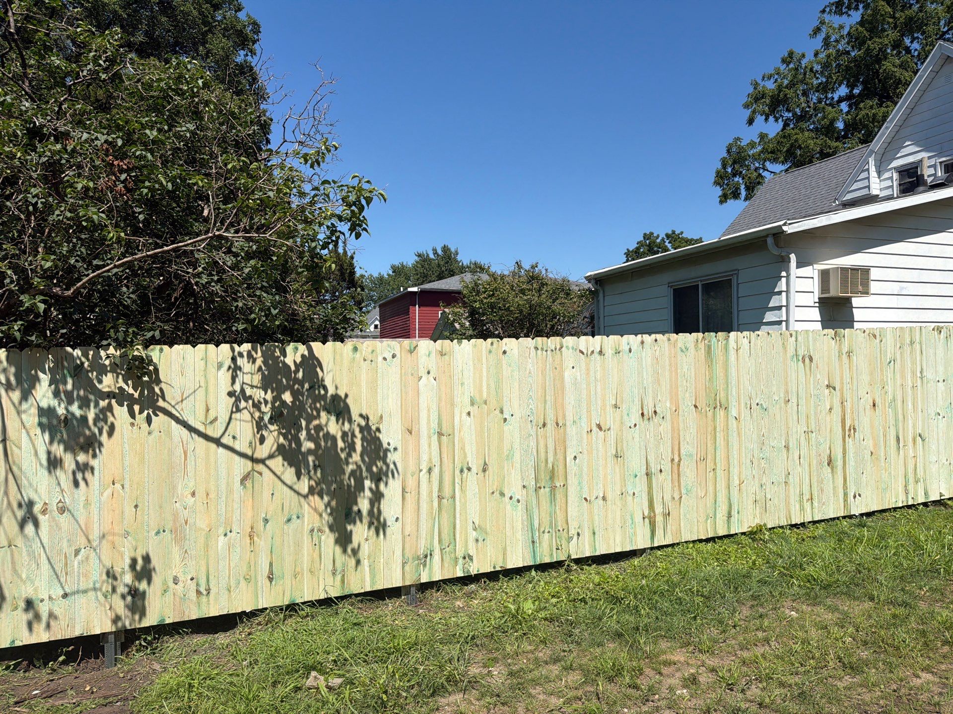 Pressure-Treated Wood Privacy Fence Installation in Waterloo by Perfect Picket Fence and Stain