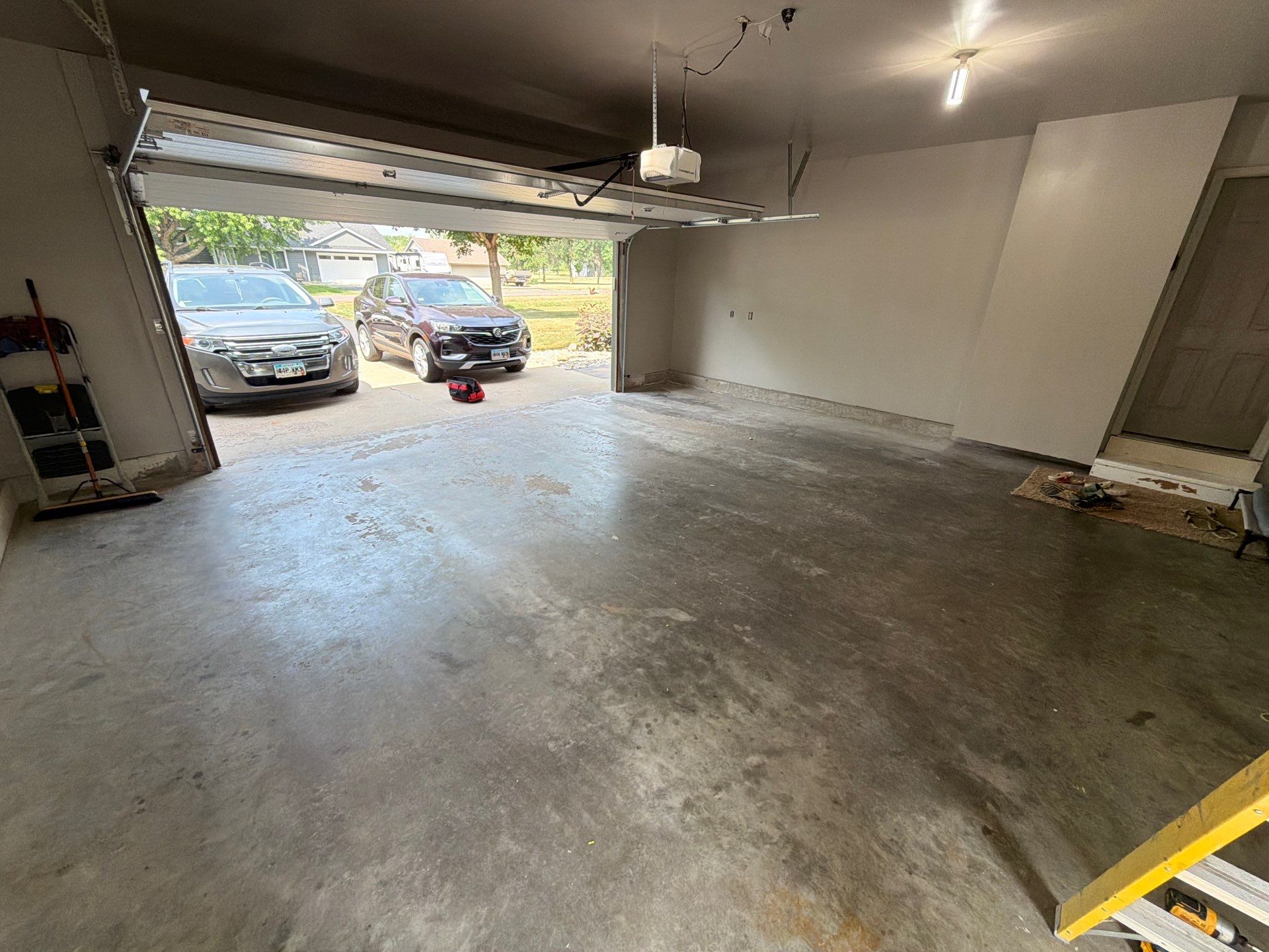 Garage Floor Coating with Decorative Flakes in Tea by Select Painting, Coatings & Garage Cabinets