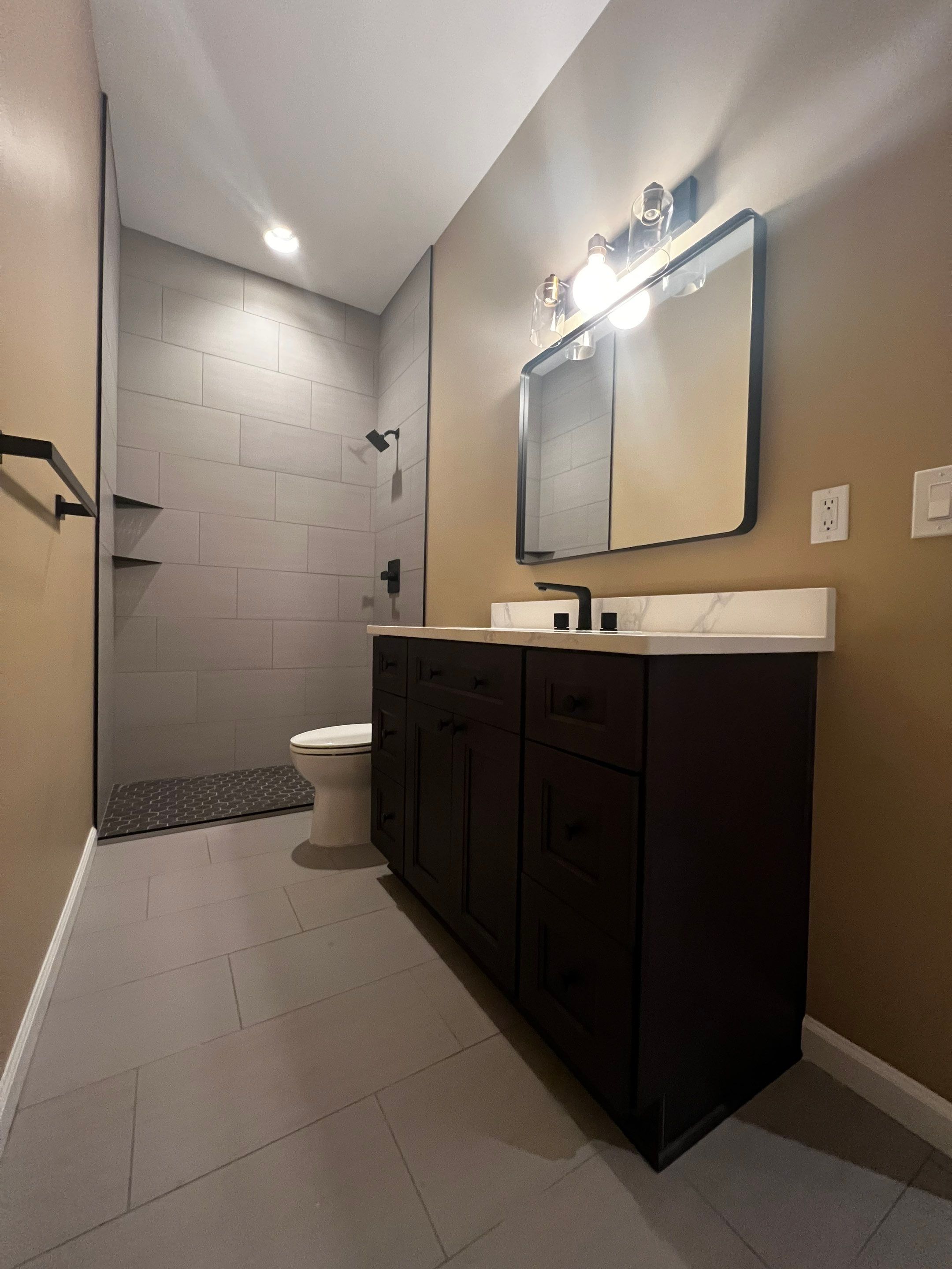 Finished Basement Renovation Featuring Polished Concrete in Atlanta by Swift Home Renovations