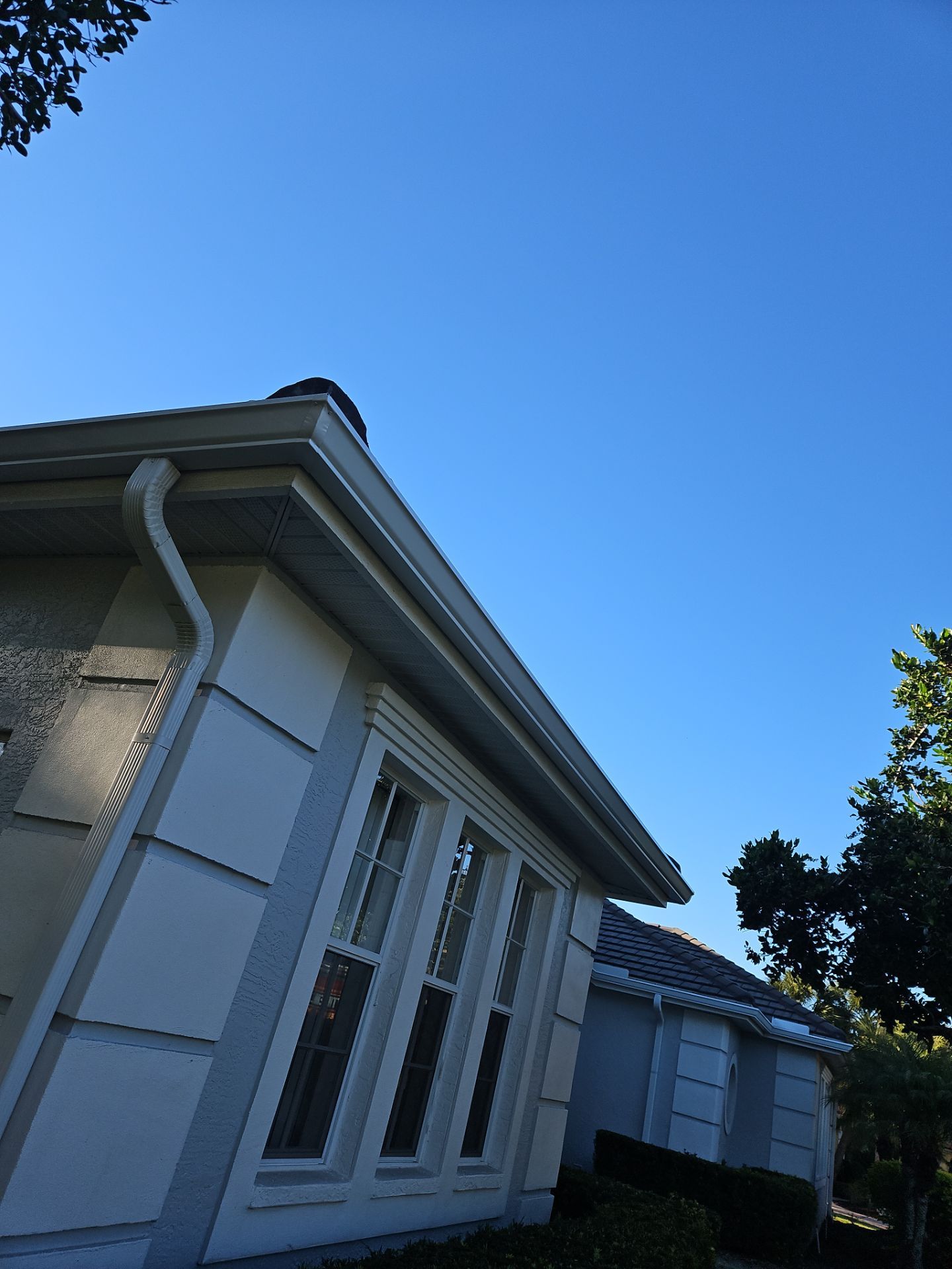 White Down Spouts using downspouts and White Seamless Gutters in Sarasota FL by Gutter Professors