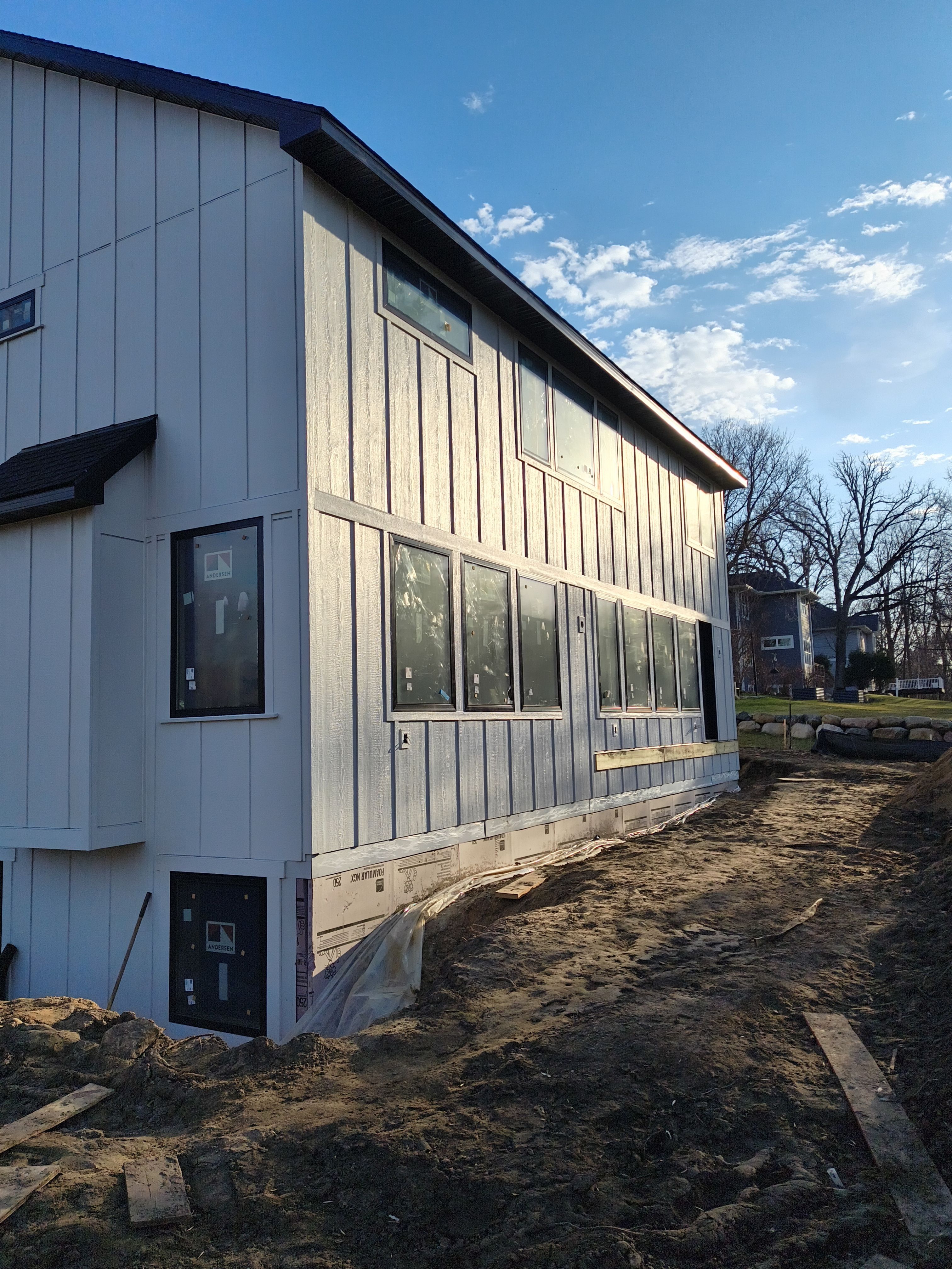 Black Seamless Gutter Installation for New Excelsior Home Build by Next Level Seamless Gutters / Exteriors Inc.