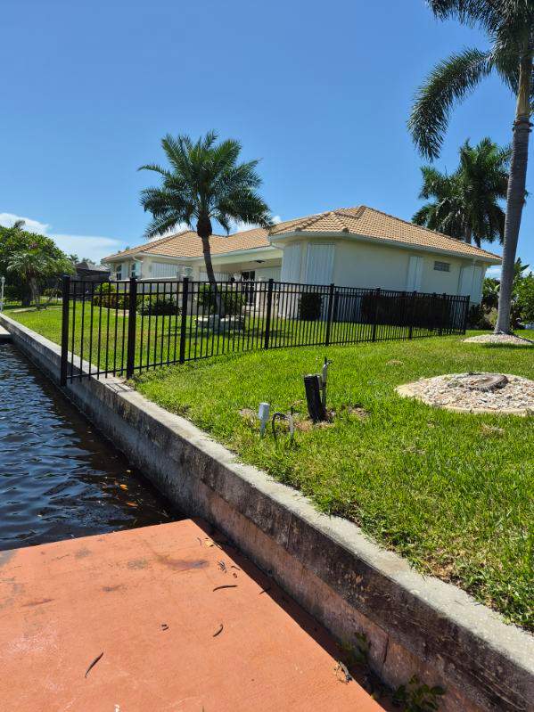Custom Black Aluminum Fence Enclosure for Punta Gorda Waterfront Property by True Fence LLC