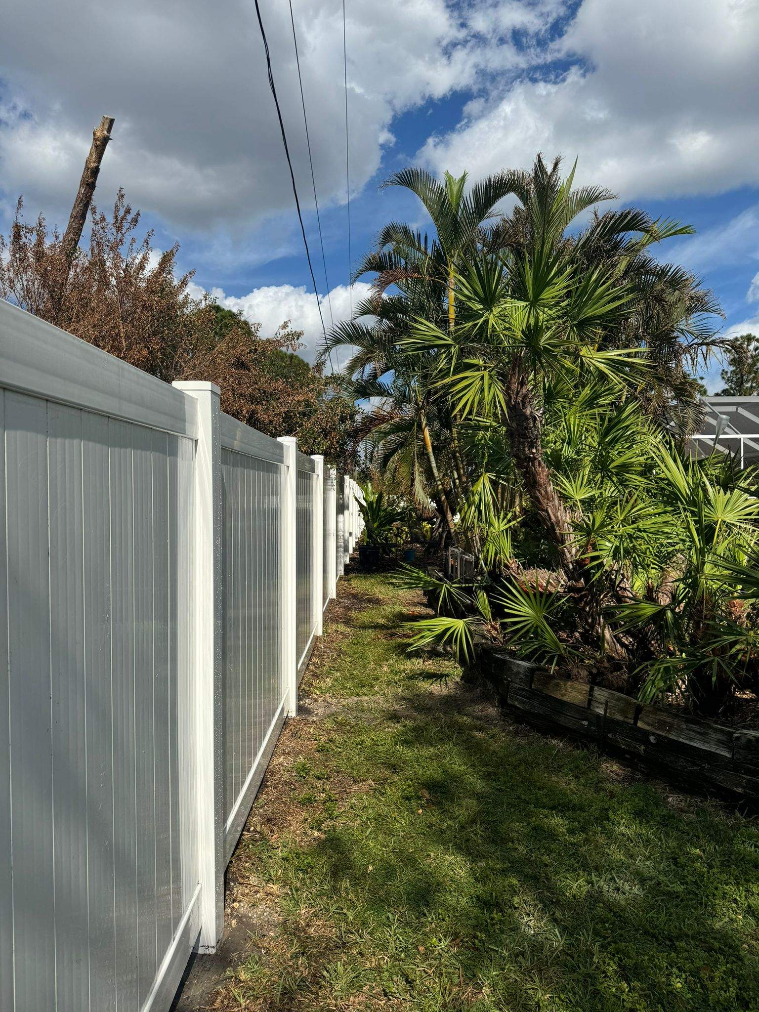 White Vinyl Privacy Fence Installation in Port Charlotte by True Fence LLC