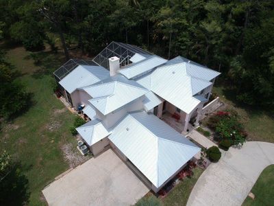 Residential Roofing Installation using 1" Nail strip metal roof