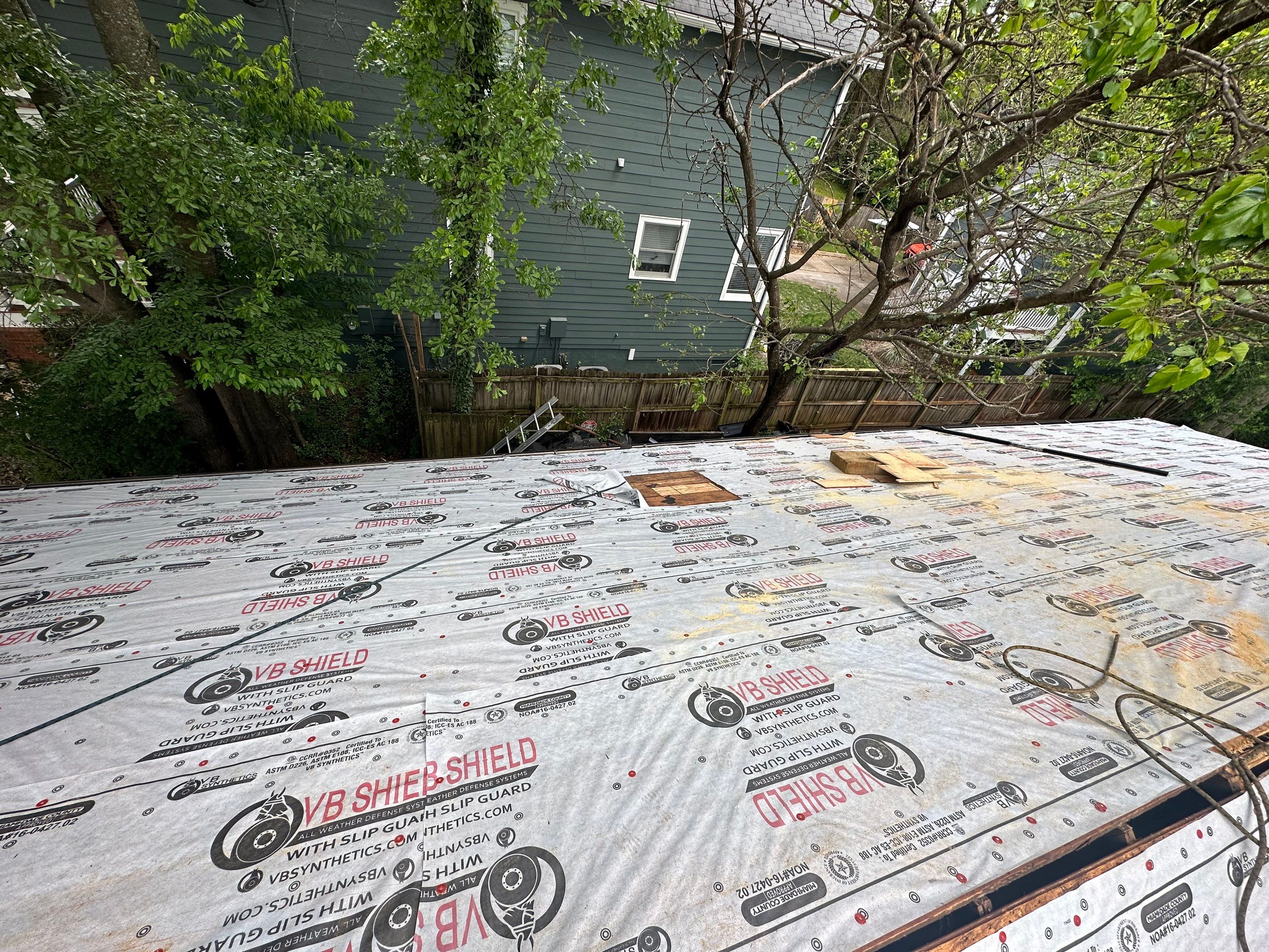 roof replacement and new black gutters by Nailed It Roofing & Remodeling LLC