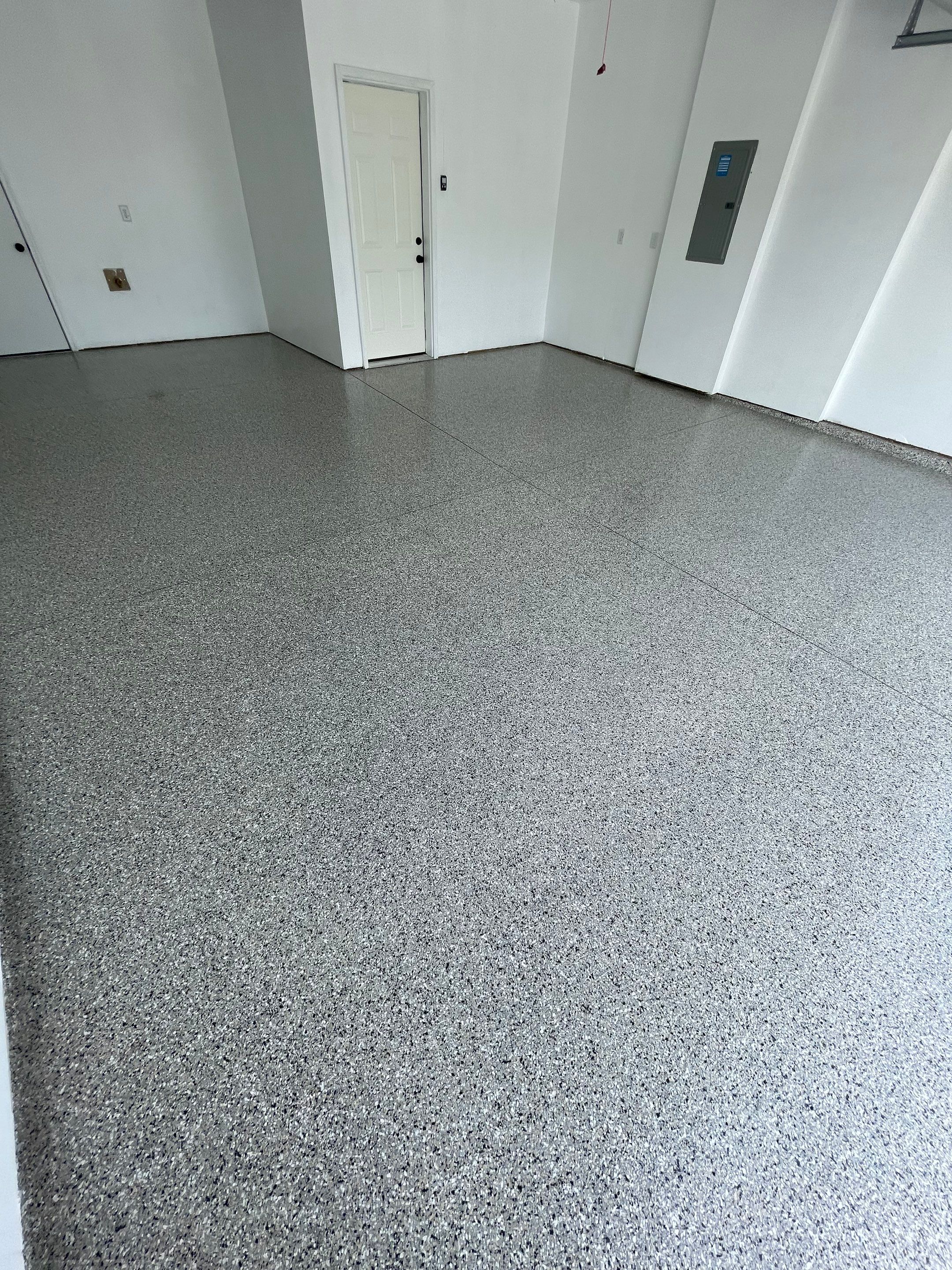 Sioux Falls Garage Floor Transformation with Cabin Fever Decorative Chips by Select Painting, Coatings & Garage Cabinets