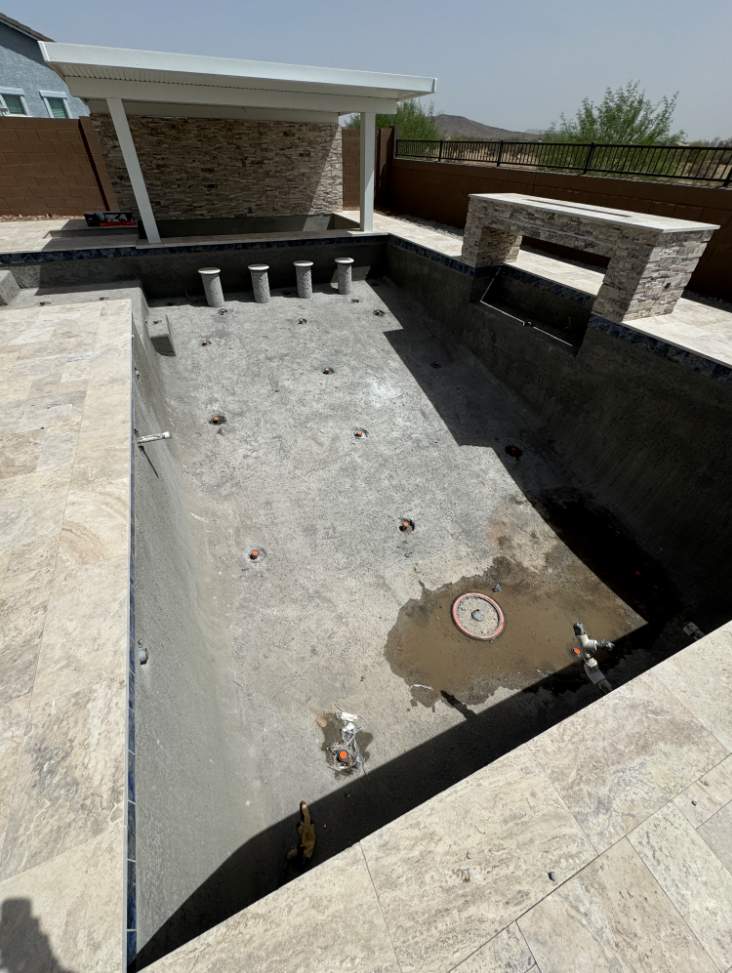 Pool build with custom water features & pergola by Modern Pools