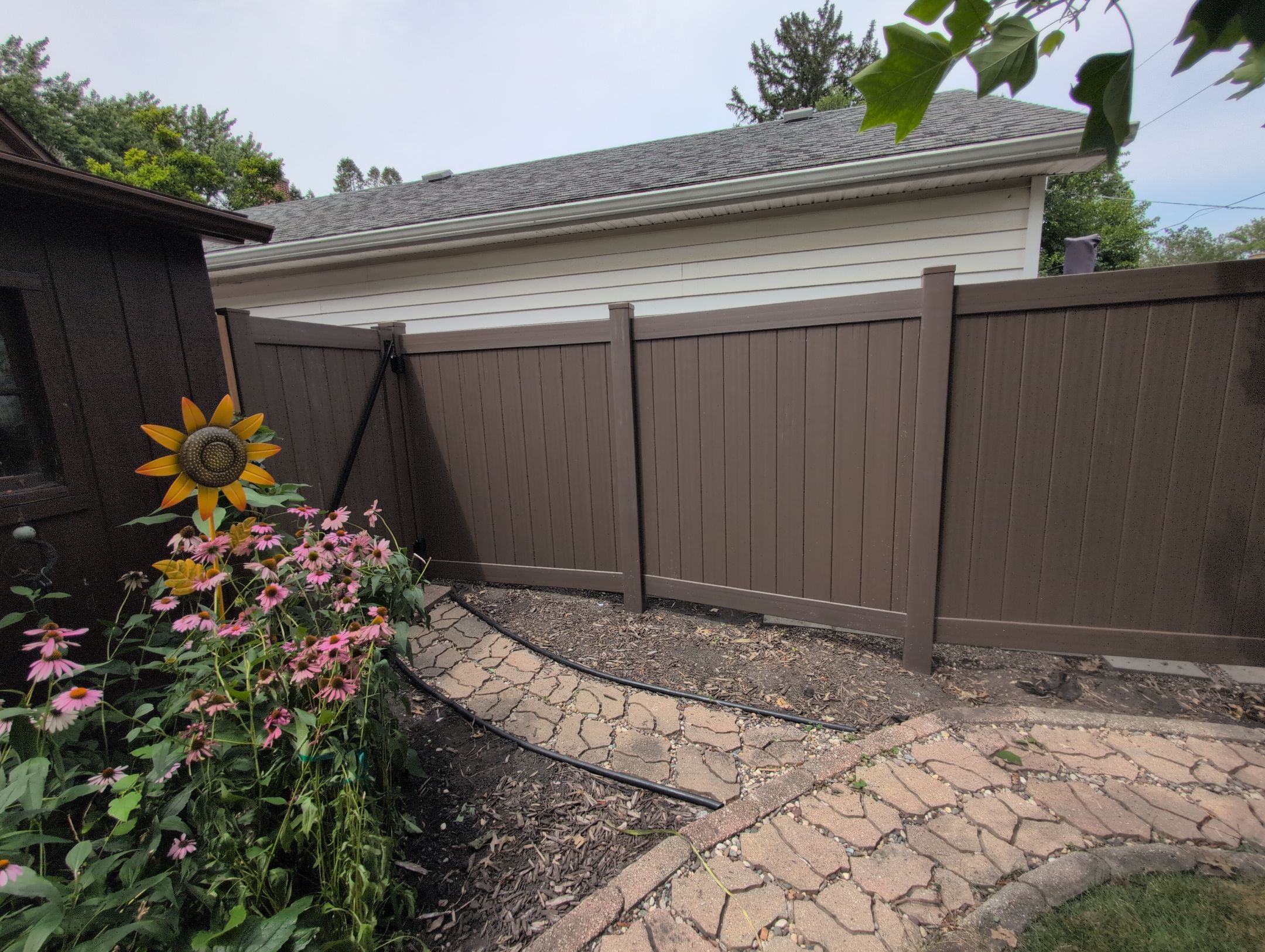 Walnut Vinyl Privacy Fence Installation in Waterloo by Perfect Picket Fence and Stain