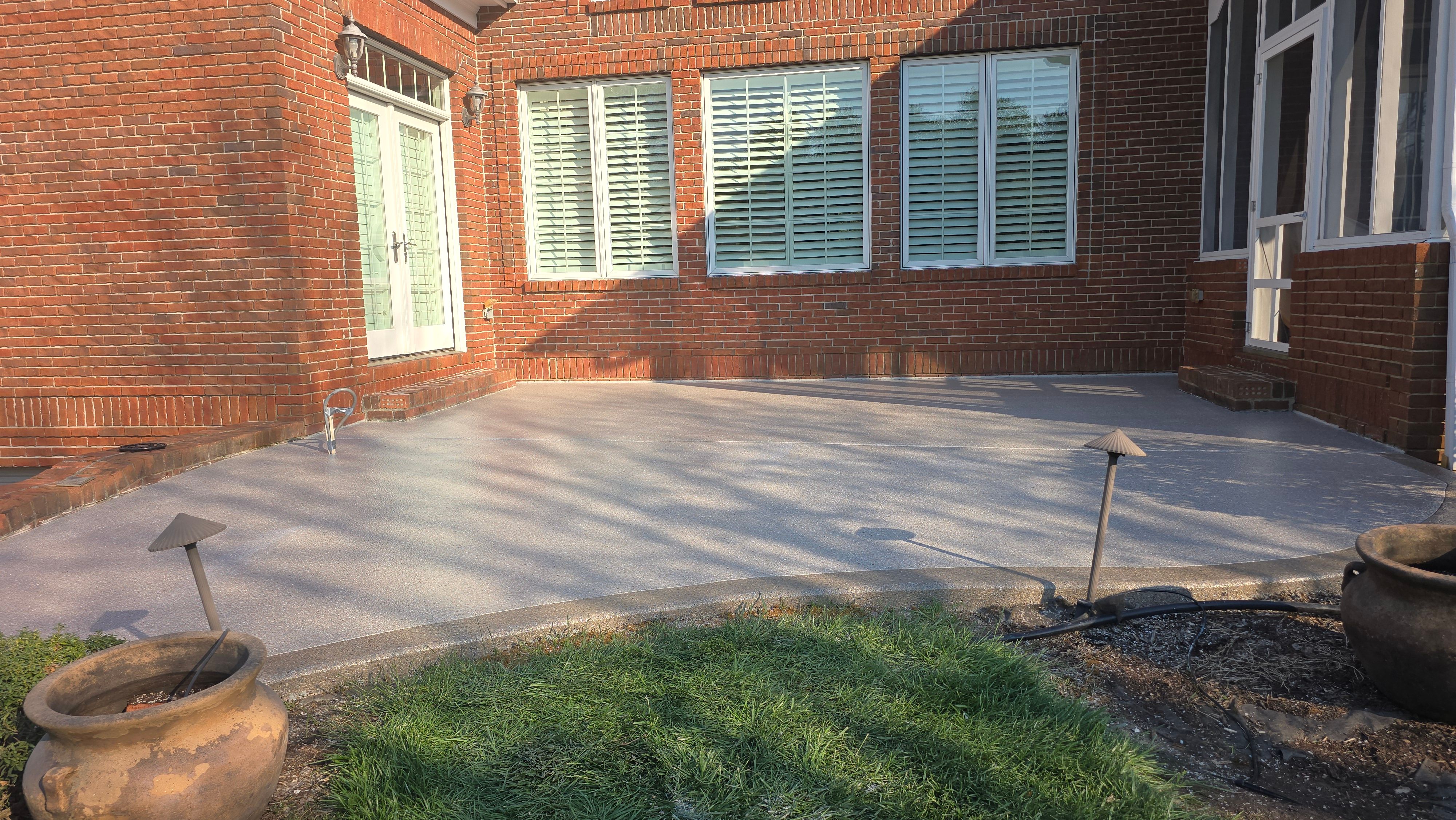 Patio in Pumice with Obsidian Border  by Elite Floor Solutions