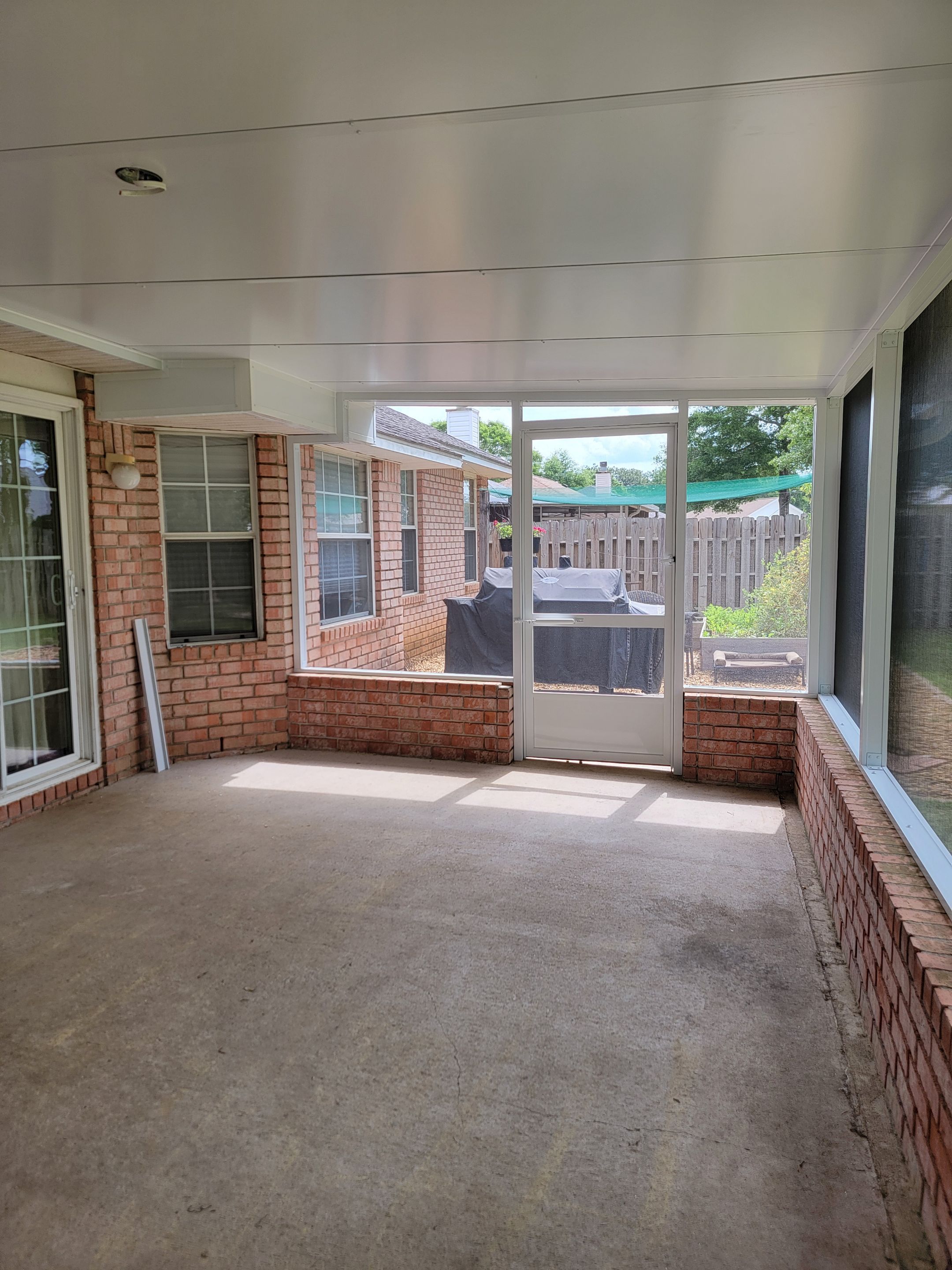 Screen Room in Milton w/Brick Kneewall by Titan Sunrooms