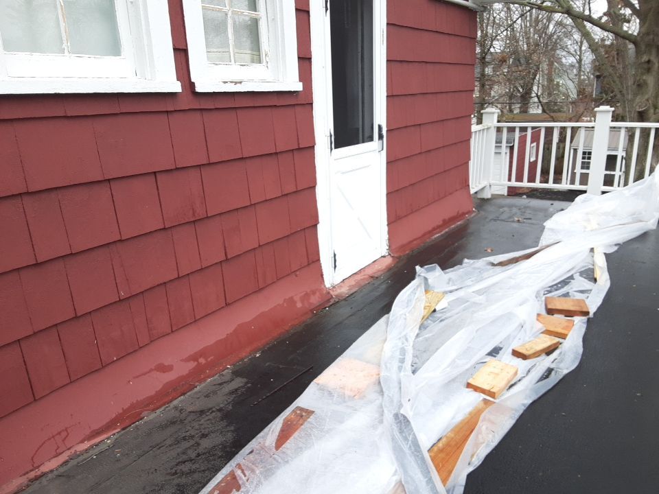 Residential Roof Replacement using Patio Roof by Absolute Roofing and Construction