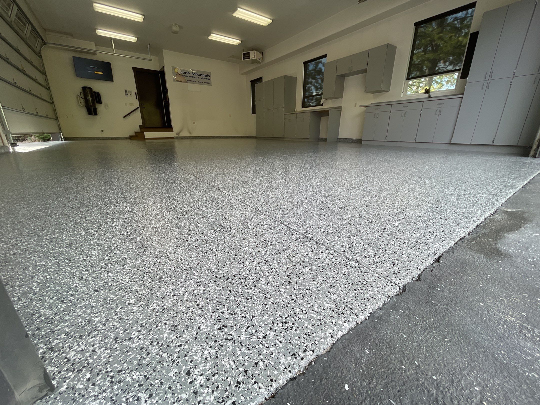Garage Transformation using Smoke and the Penntek Evolution System by Croc Coatings, LLC