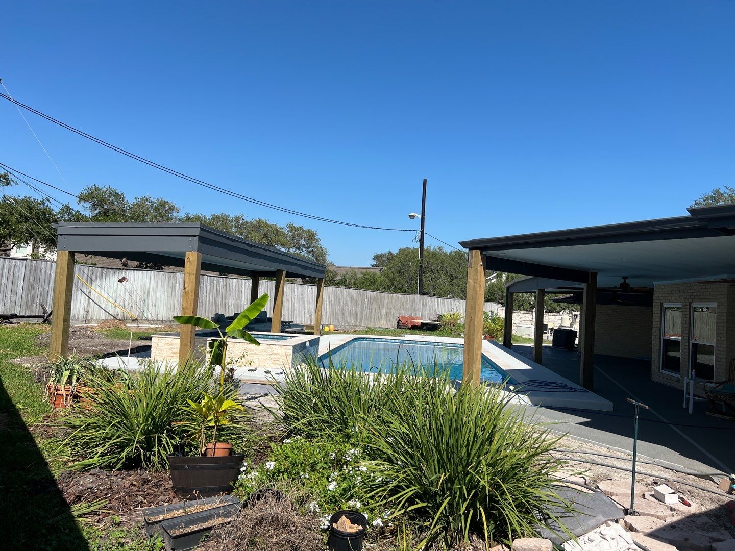 Beautiful pool side build by Bayfront Roofing and Construction