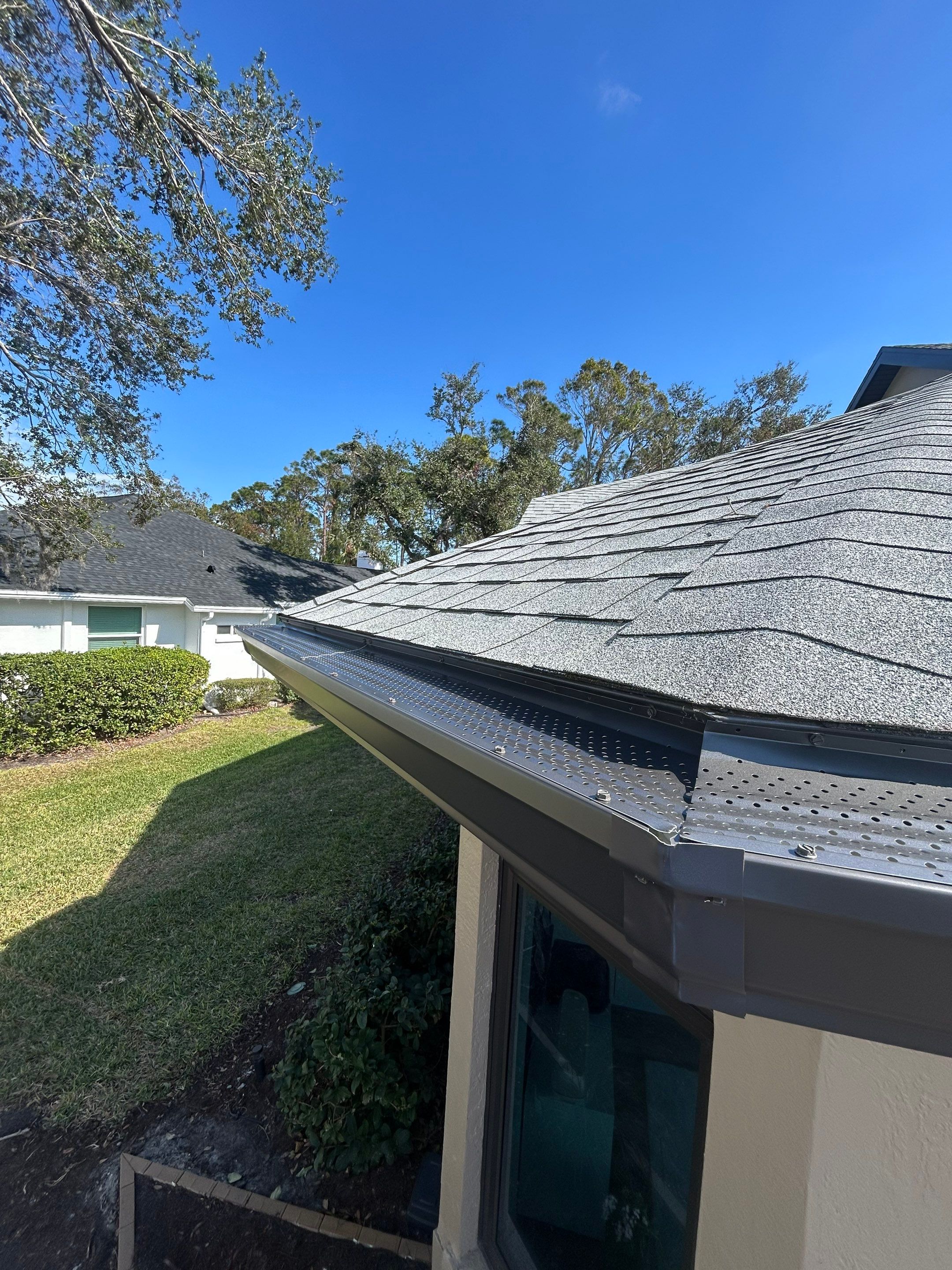 Black Seamless Gutters in Sarasota FL by Gutter Professors