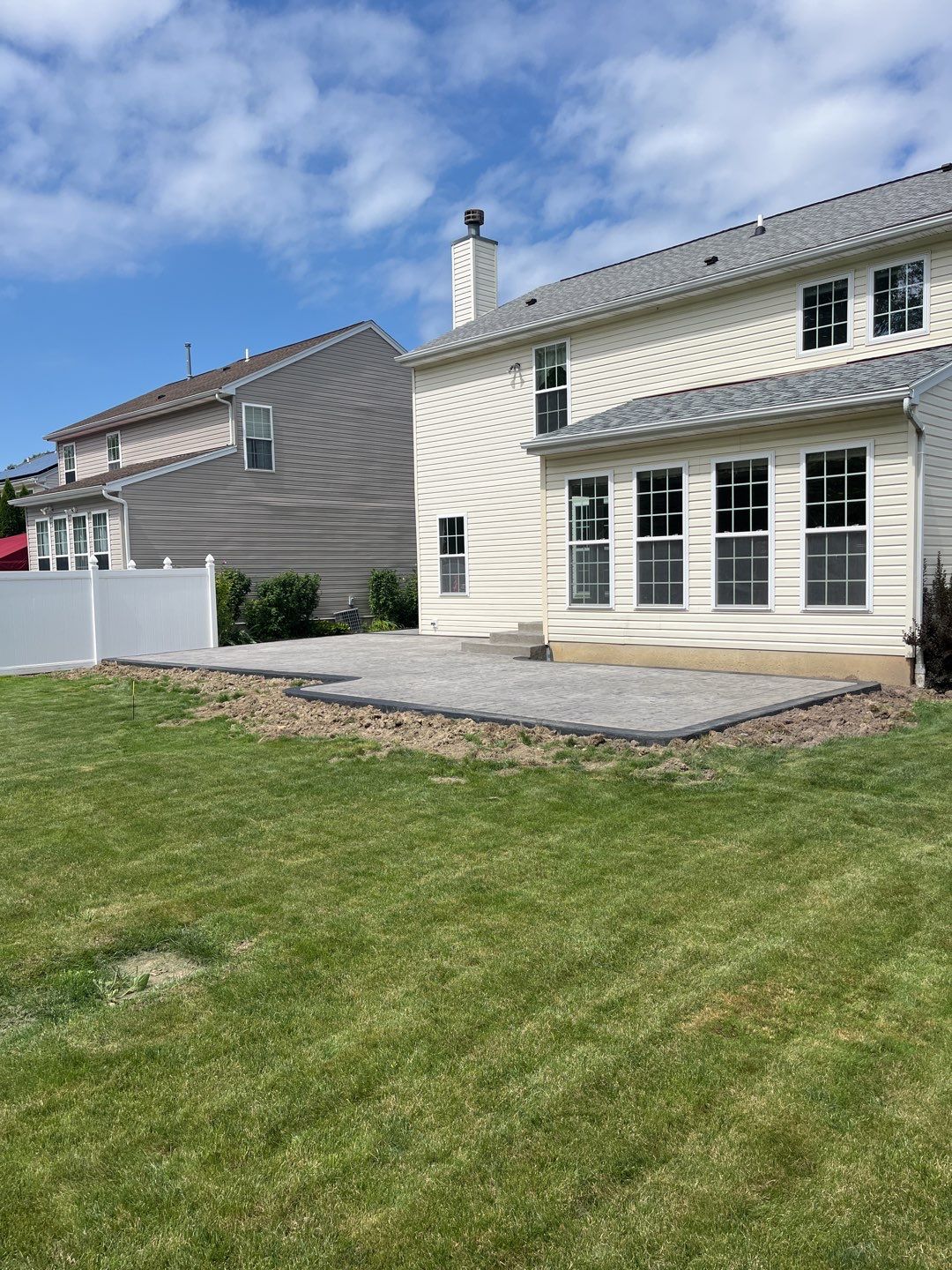 Stamped Concrete, Entry Door, and Concrete  by Ivy Lea Construction