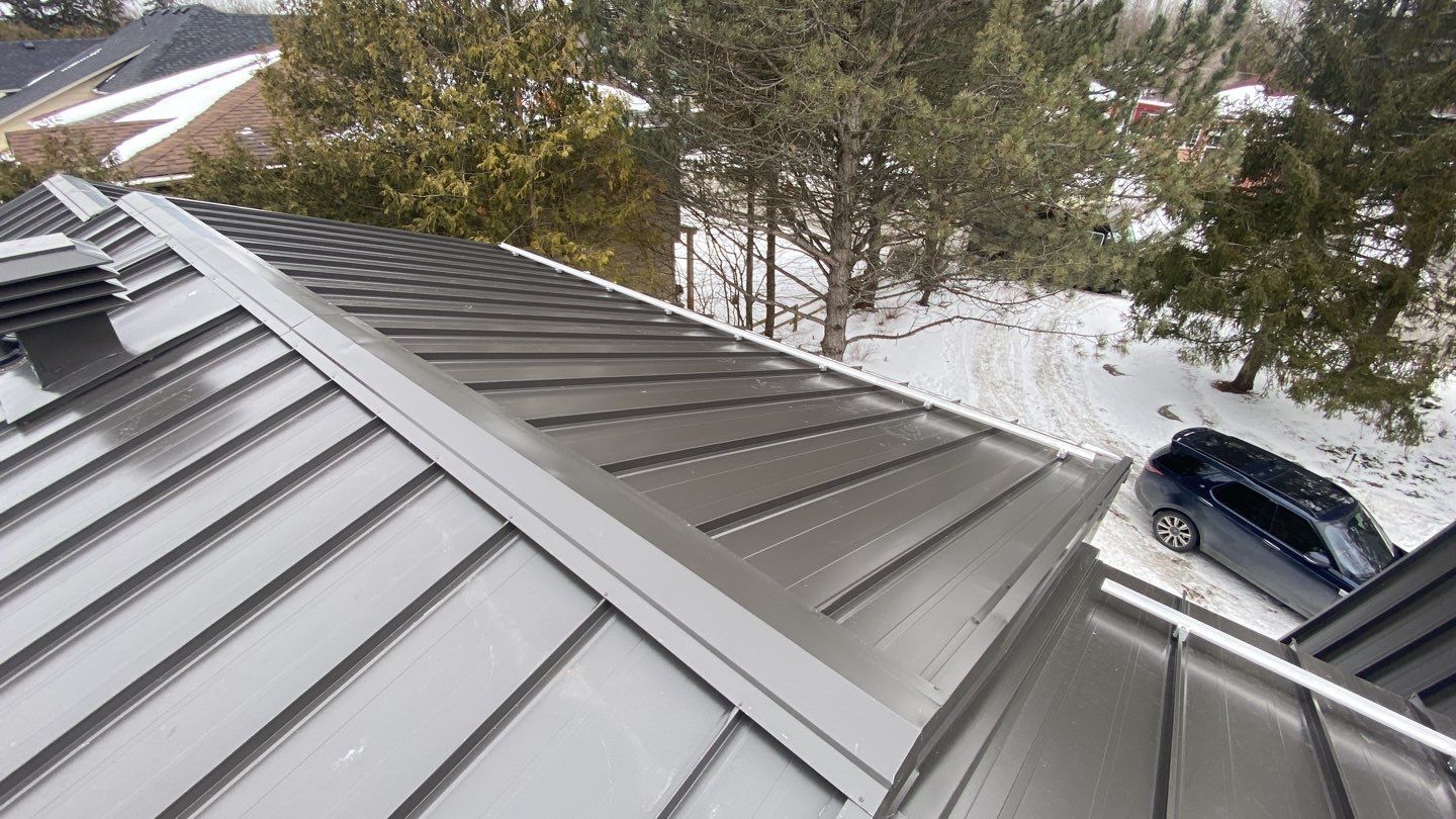 Residential Roofing Installation using 16" Standing Seam Panels by Jay Carter Roofing & Sheet Metal