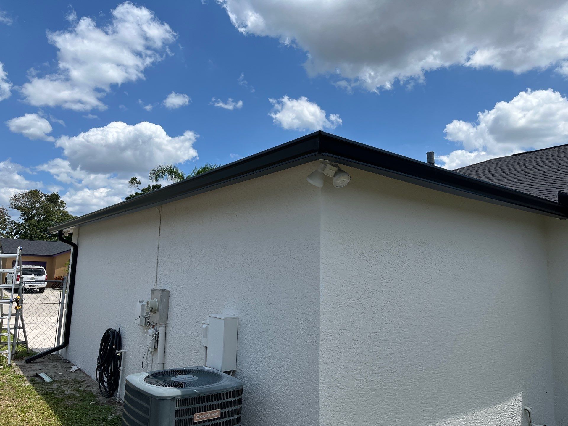 Black Seamless Gutters and Downspouts in Fort Myers FL by Gutter Professors